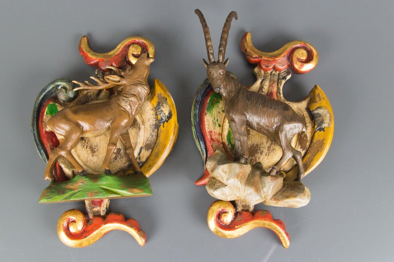 A pair of beautiful Baroque style polychrome carved wood wall decors depicting deer and ibex figures. Painted in brown, green, red, and golden colors.
Dimensions: height 35 cm / 13.77 in, width 22 cm / 8.66 in, depth circa 10 cm / 3.93 in.