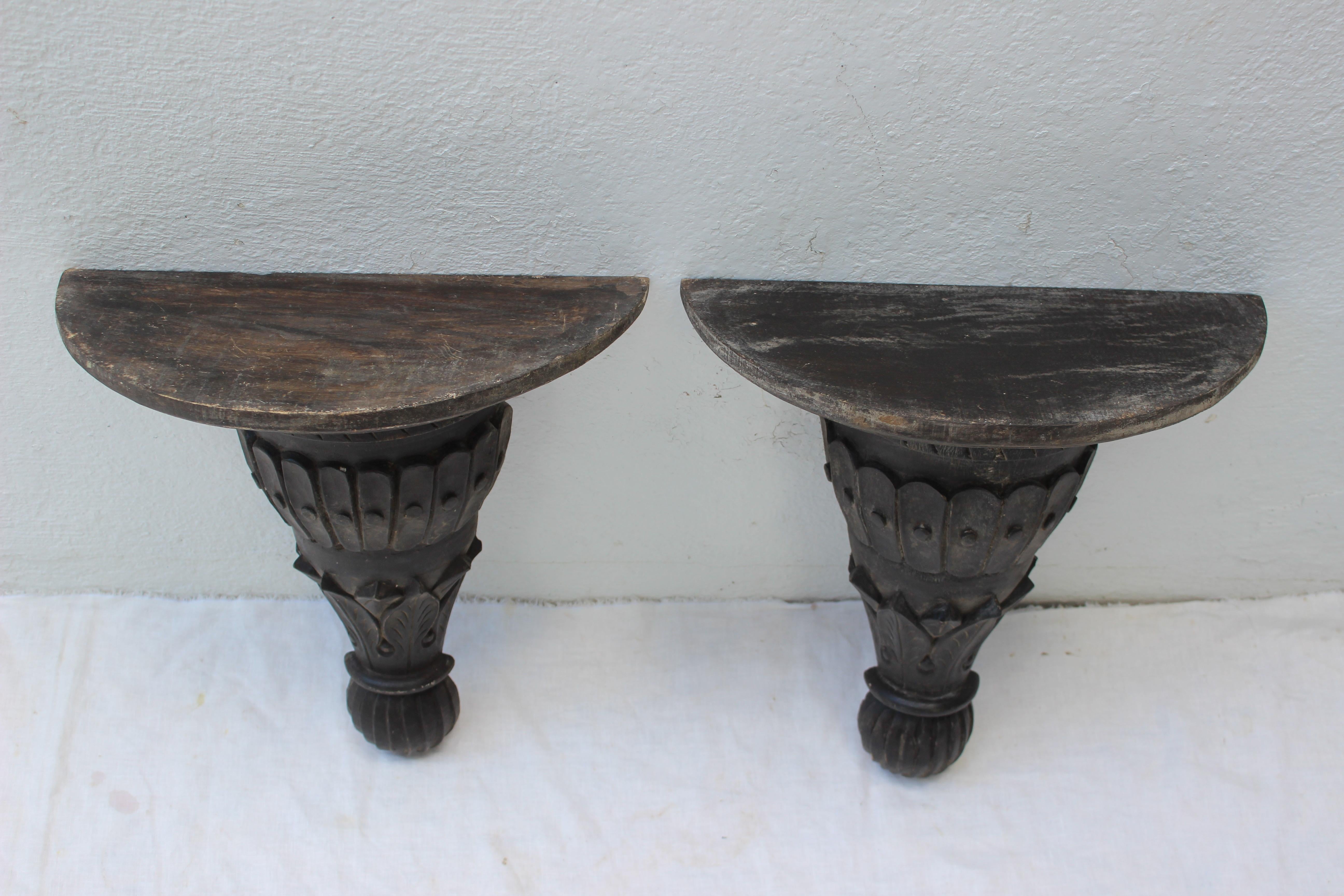 Pair of carved wood wall brackets.