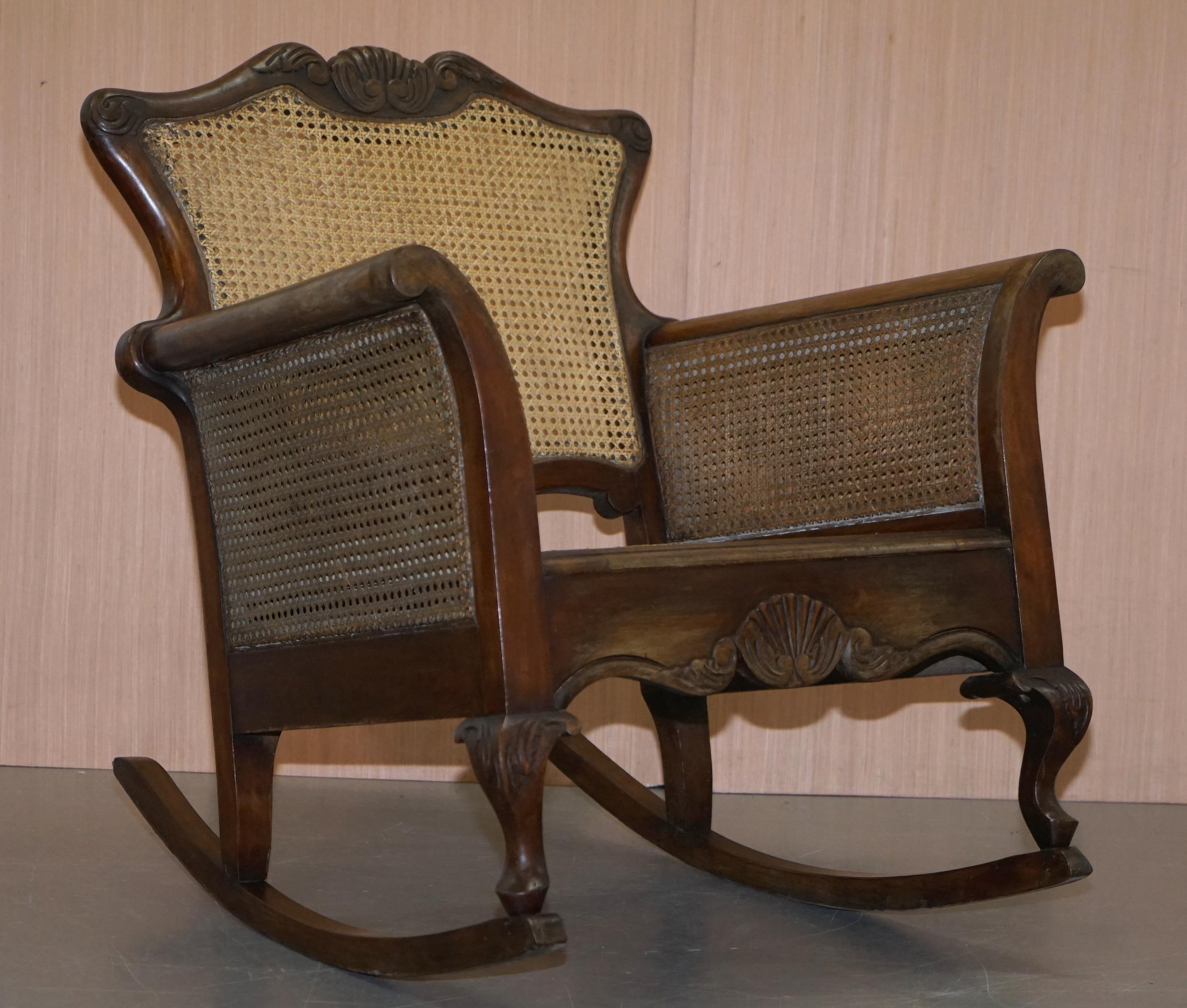 We are delighted to offer for sale this very rare pair of Italian circa 1920s Berger rocking armchairs with hand carved hardwood frames

A very good looking and exceptionally comfortable pair of rocking chairs. I have never seen another like