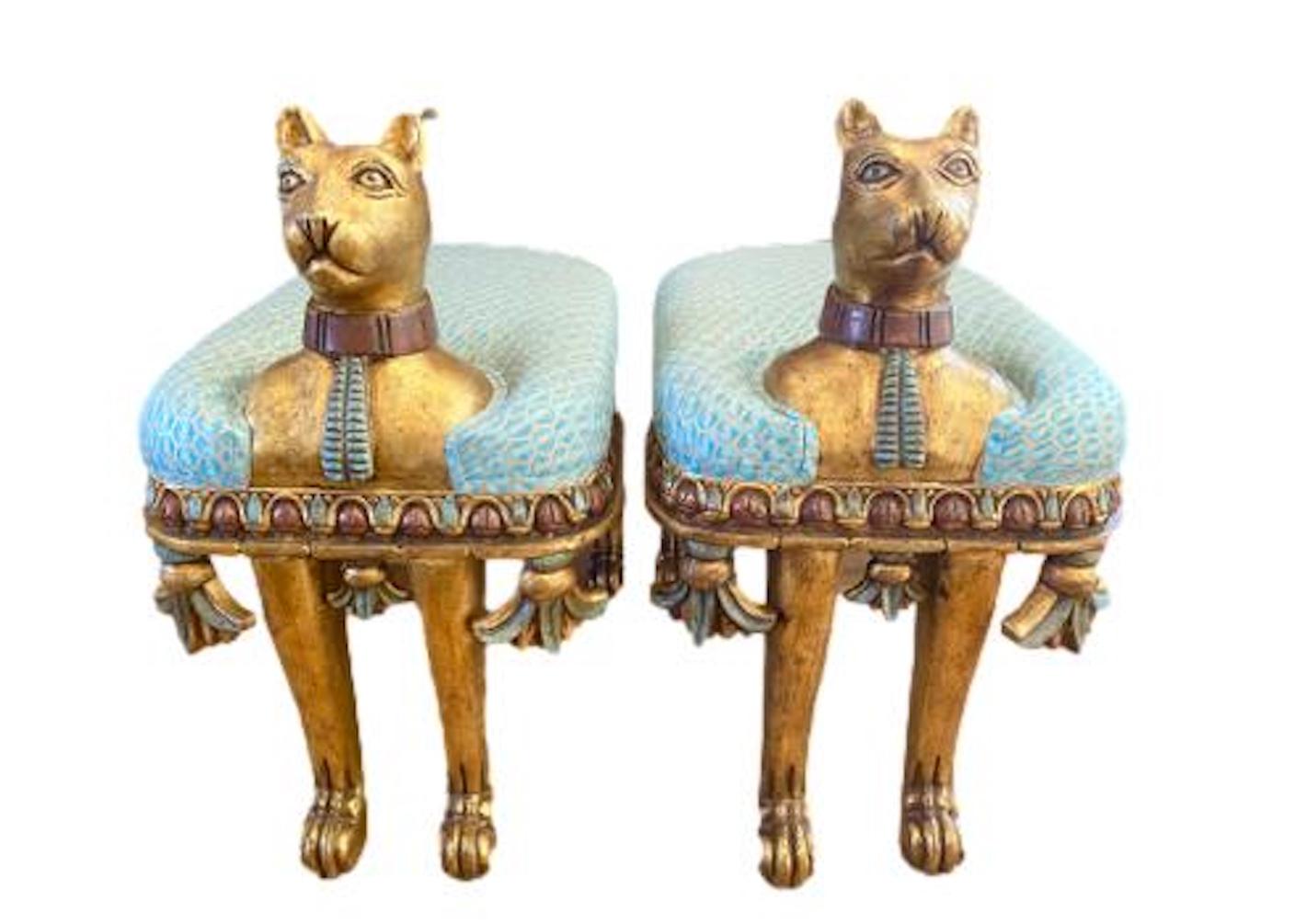 Unique pair of Egyptian Revival cat benches newly upholstered in Venetian, Fortuny fabric. Carved wood is gilt and painted.