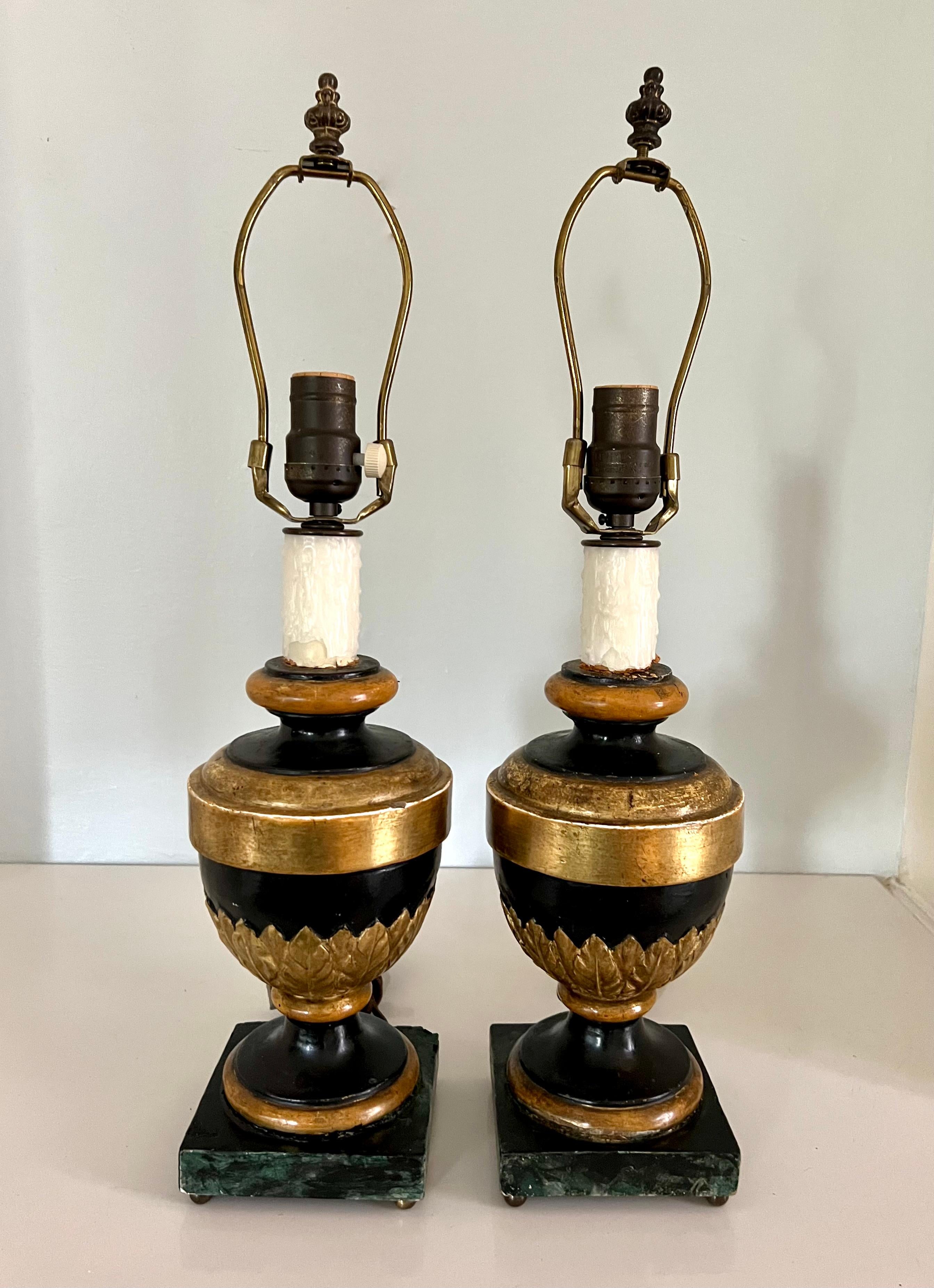 The pair are definitely fussy and with a bit of a weathered look. With had done centers and faux marble bases, the pair also have a good deal of gilt details, the shades, which are included, are very nice hand-made parchment shades with wonderful