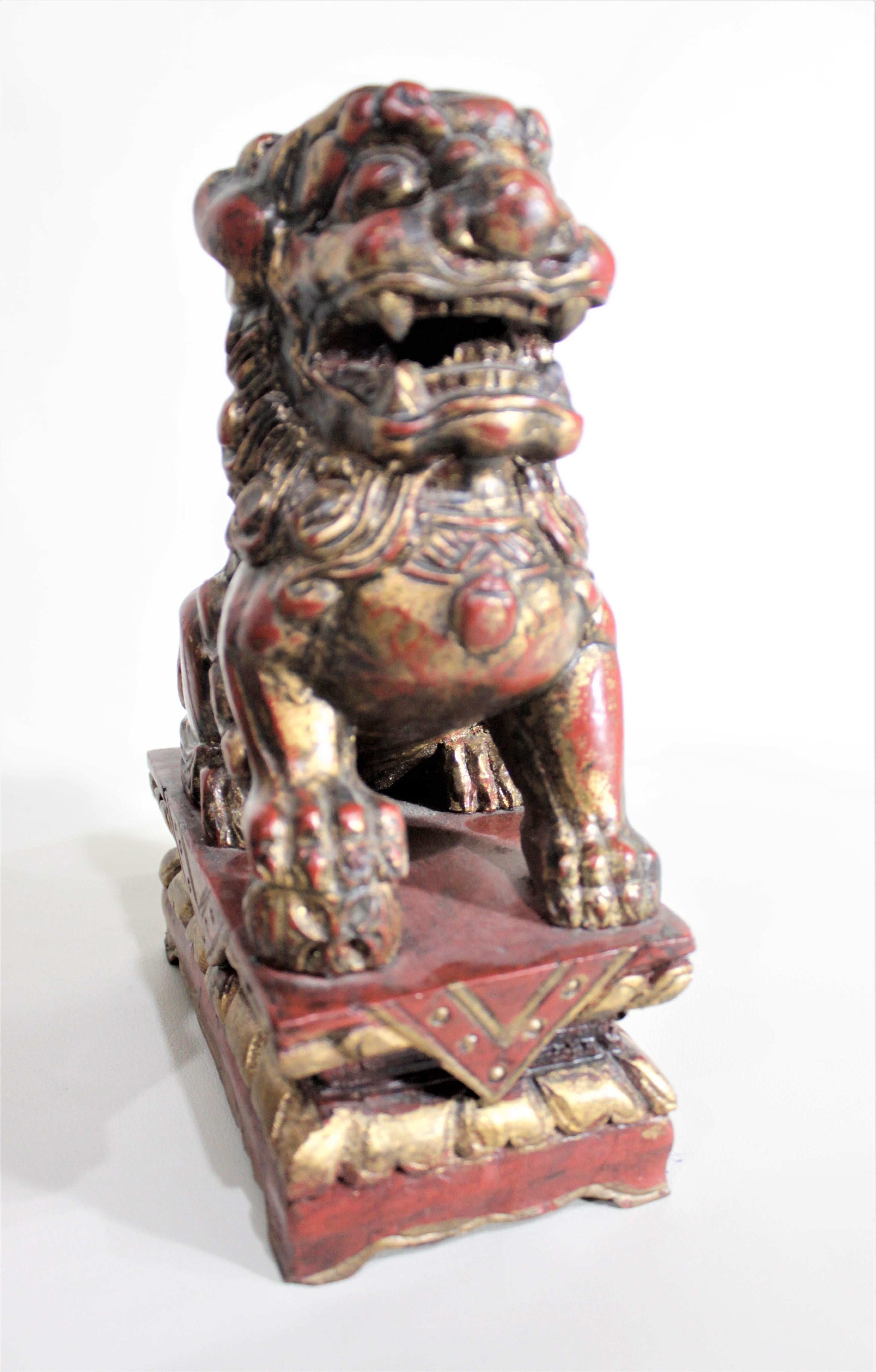 Softwood Pair of Carved Wood and Gilt Finished Chinese Foo Dog Figurines or Sculptures For Sale