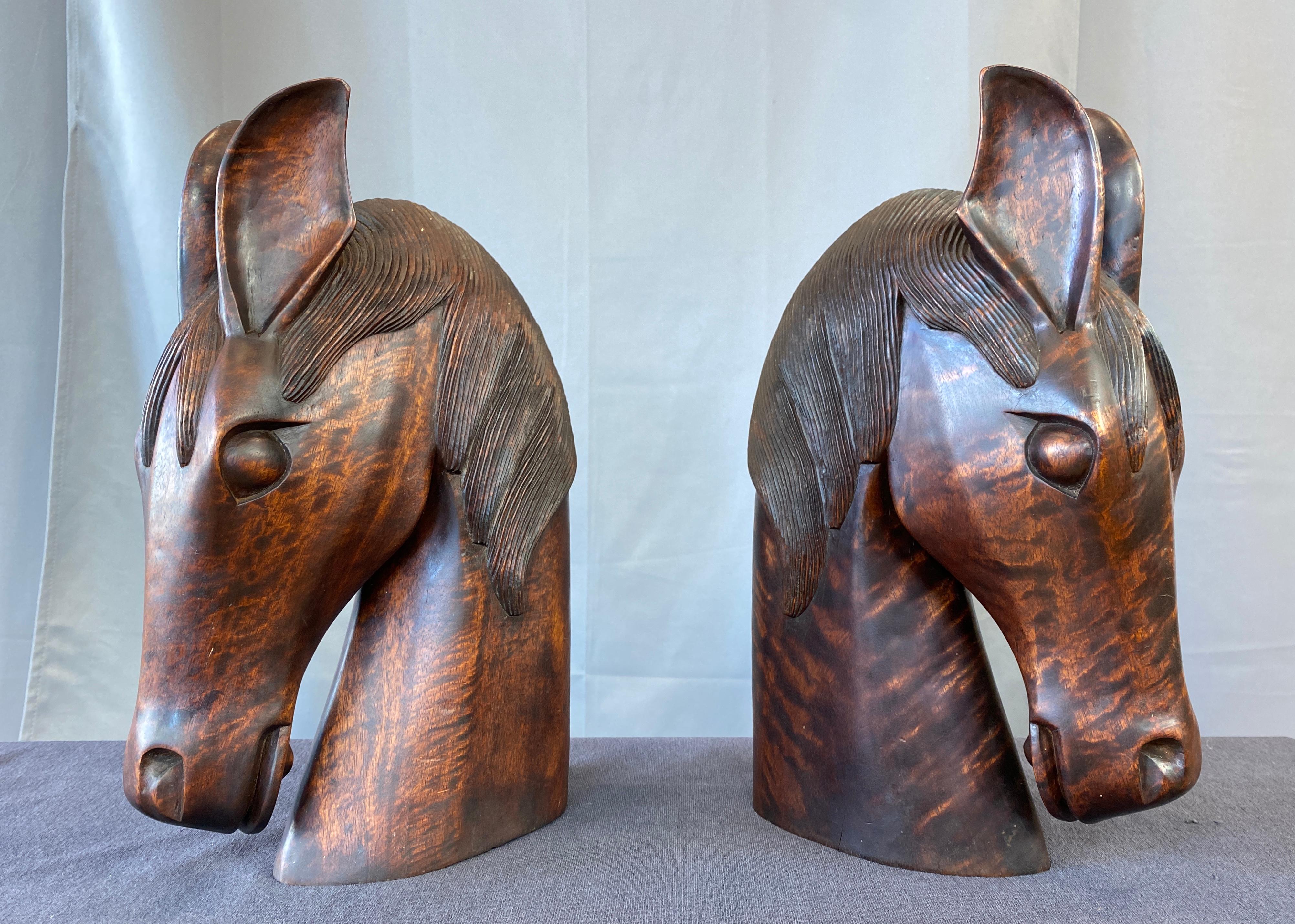 Wonderful pair of carved wood horse heads, circa 1960s.