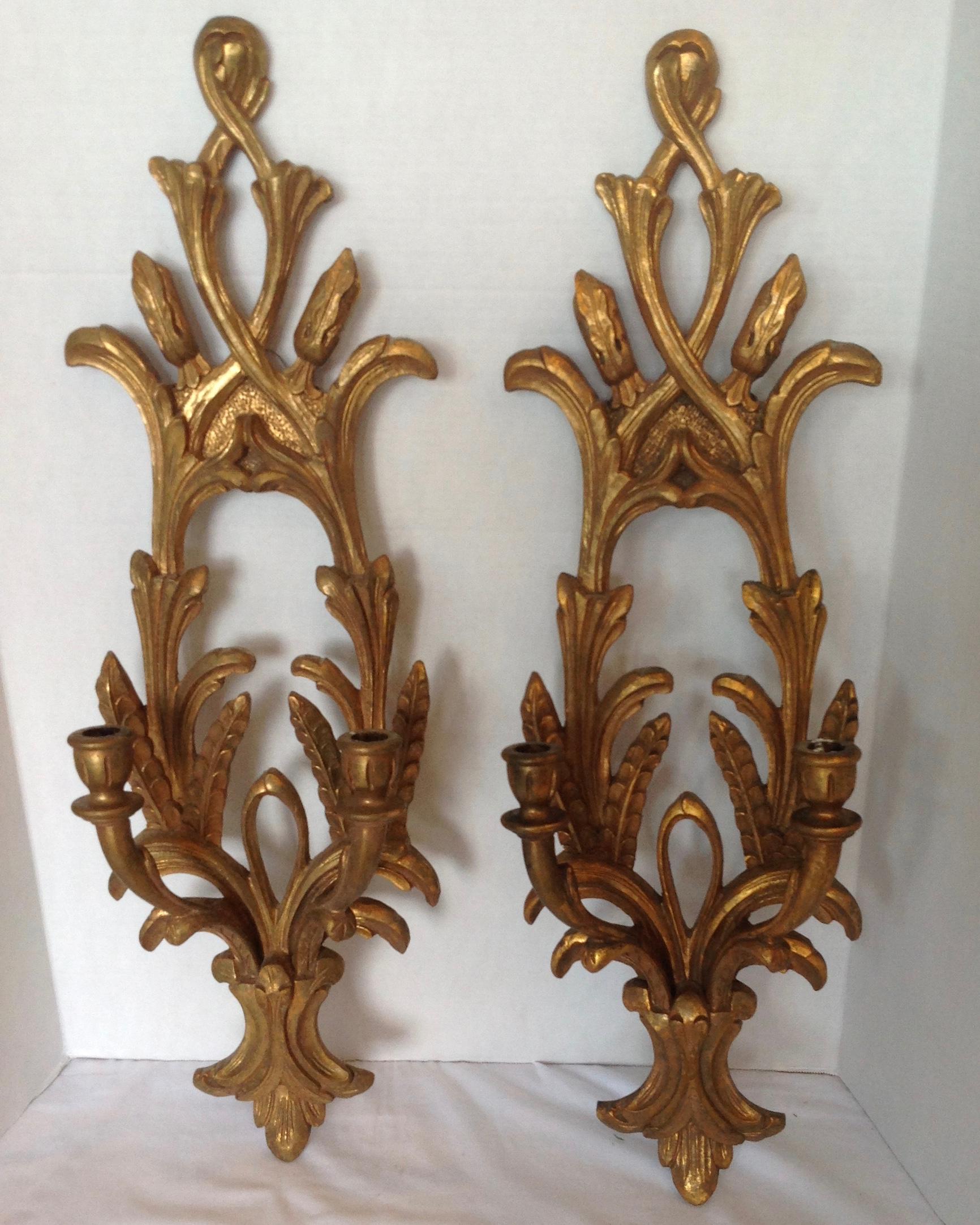 Superbly carved giltwood foliate style sconces of large dimensions.
They are outfitted for candles.