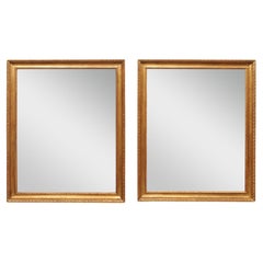 Paire de miroirs en Wood Wood sculptés, cadre en or avec garniture en forme d'œuf et de fléchette et de langue d'agneau