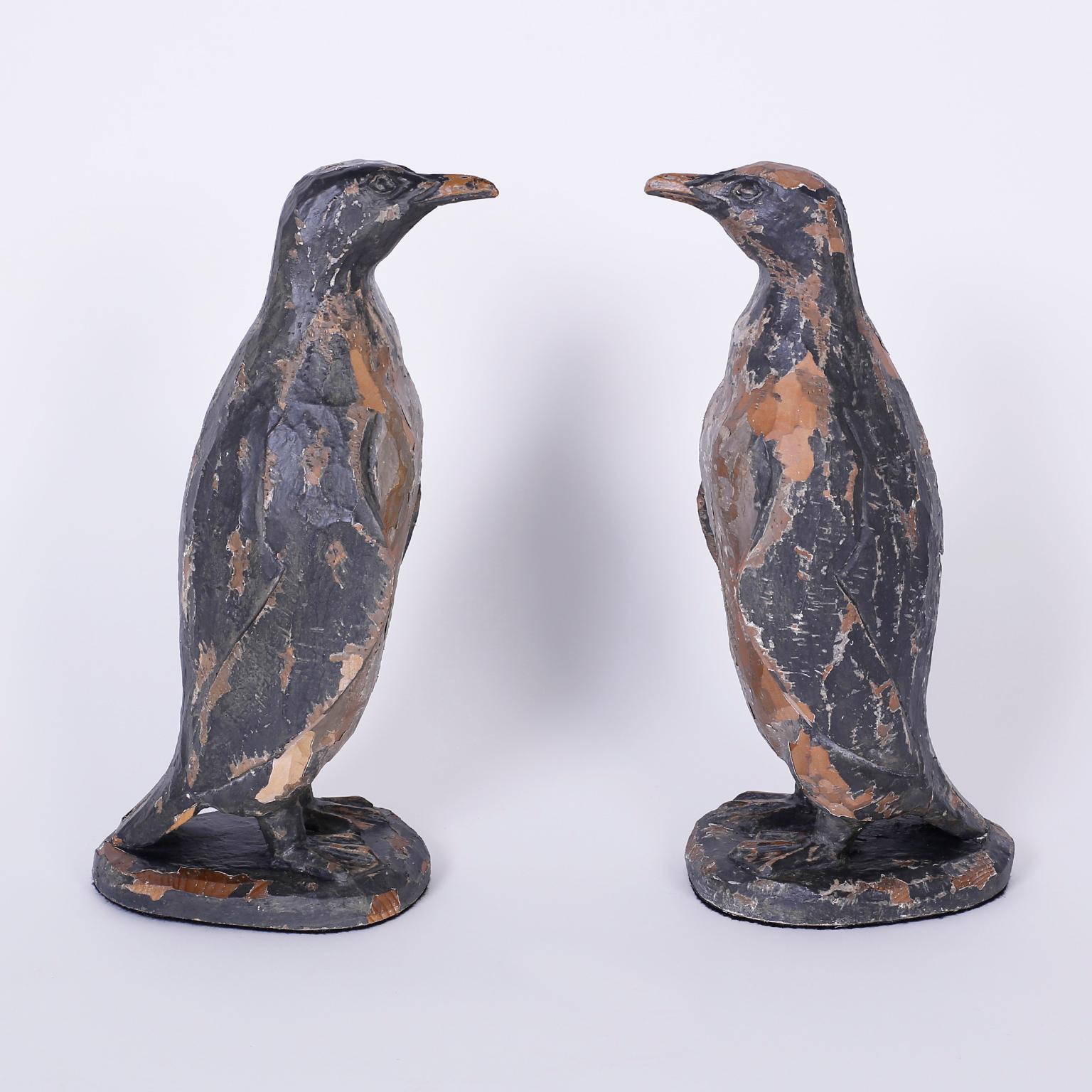 carved wooden penguins