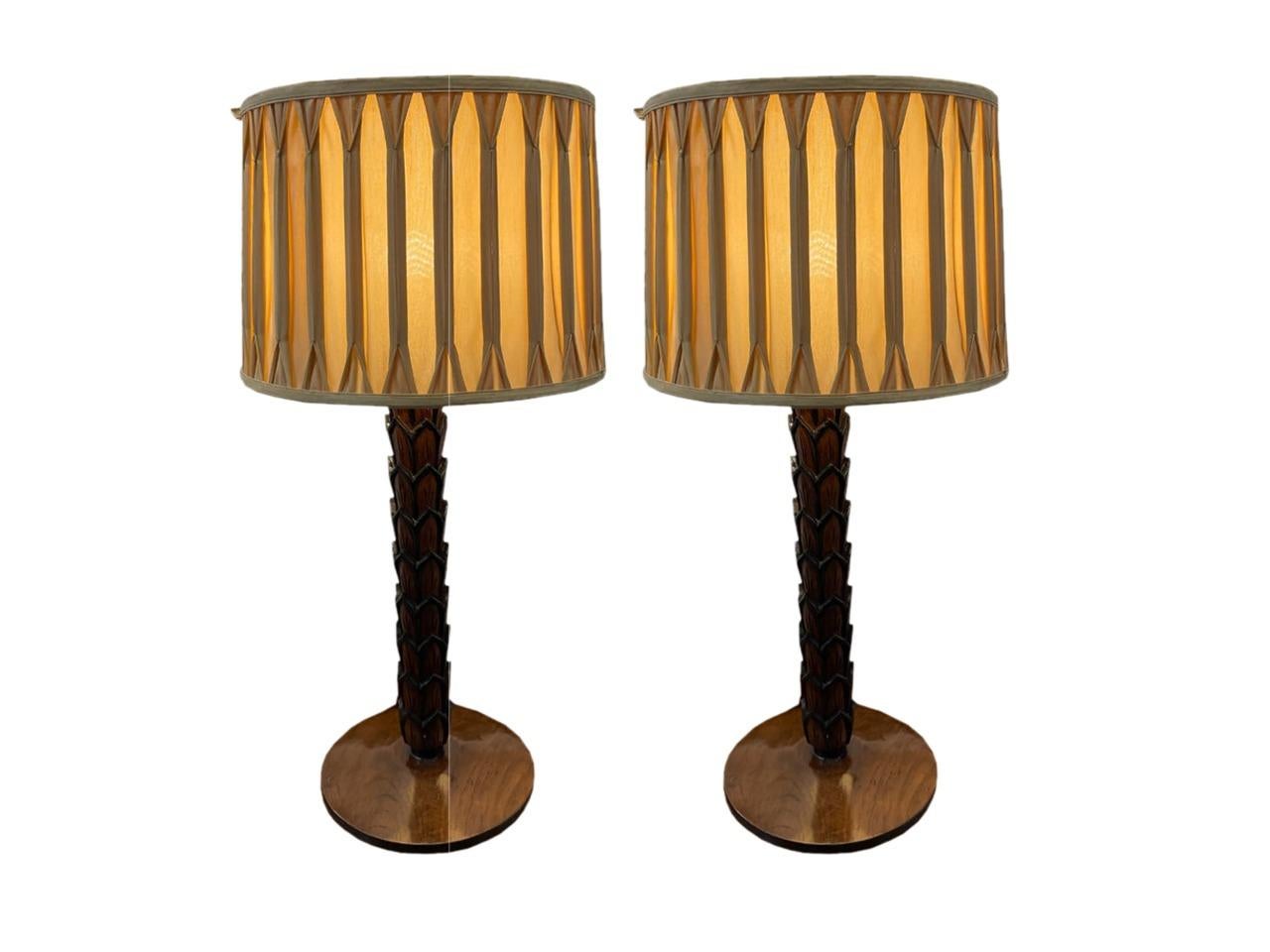 A pair of stunning, carved teak table lamps. The stems are 2.5