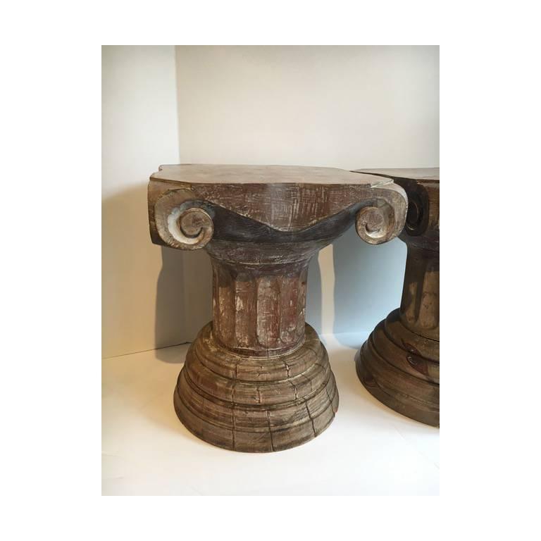 Pair of carved wooden column sculptural pedestal tables. A handsome and useful pair - easily used for a quick martini or outdoor table or a stool for that last mixture seat - a compliment to many rooms, from eclectic to stark and modern.