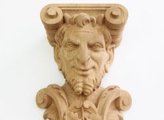 Pair of Carved Wooden Corbels with the head of Bacchus
