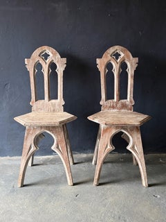 Pair of carved wooden Gothic-Revival chairs