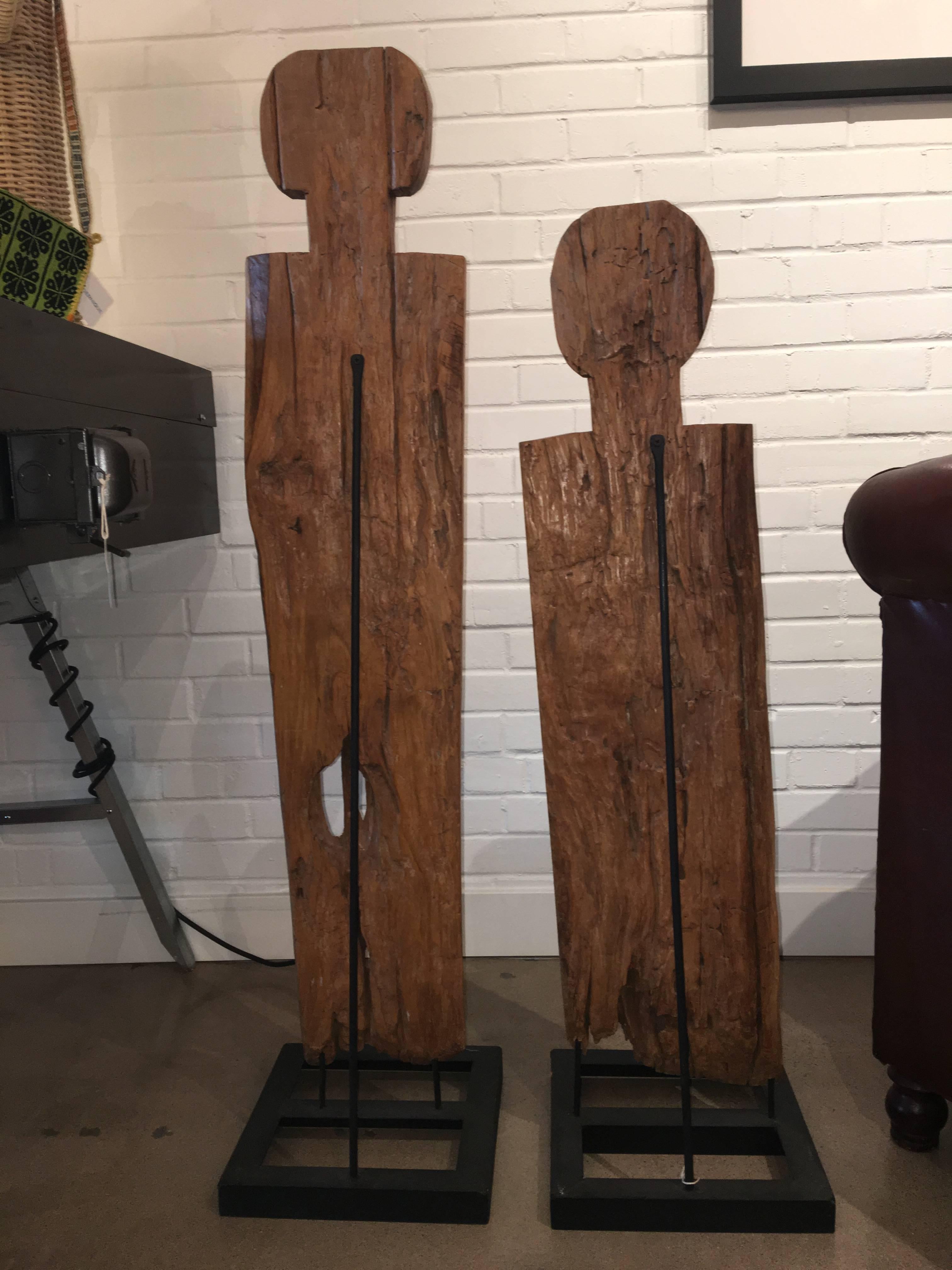 Pair of happy, smiling midcentury wooden man and woman sculptures. Sold separately but wonderful as a pair. Mounted on metal stands.
Dimensions:
Tall (Man) H 48.5