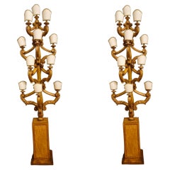 Paire de porte-torches en bois sculpté