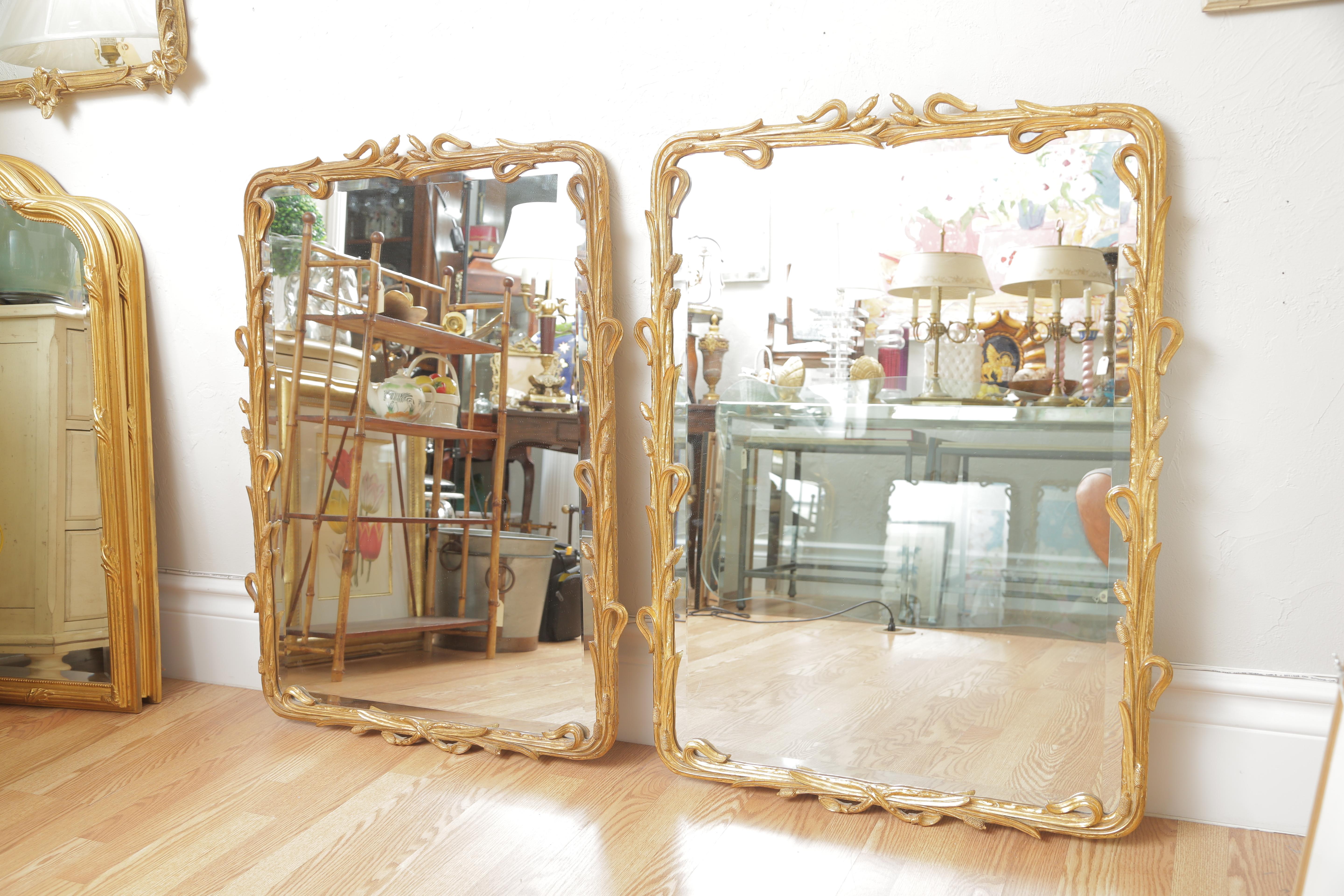 Pair of gilded carver's guild mirrors.