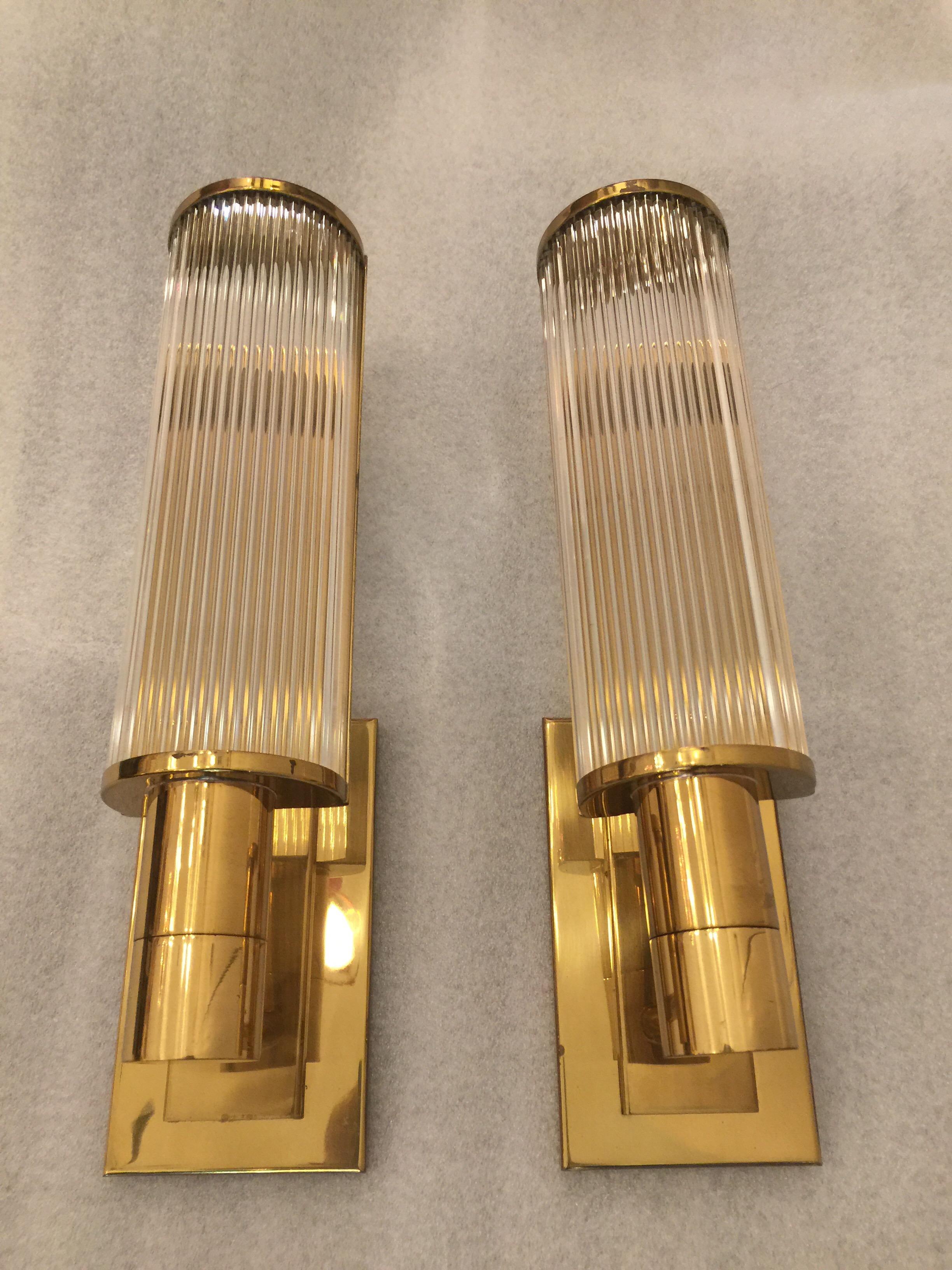 High quality pair of sconces by Casella Lighting in the Art Deco style featuring glass rod detail. In good vintage working condition.
