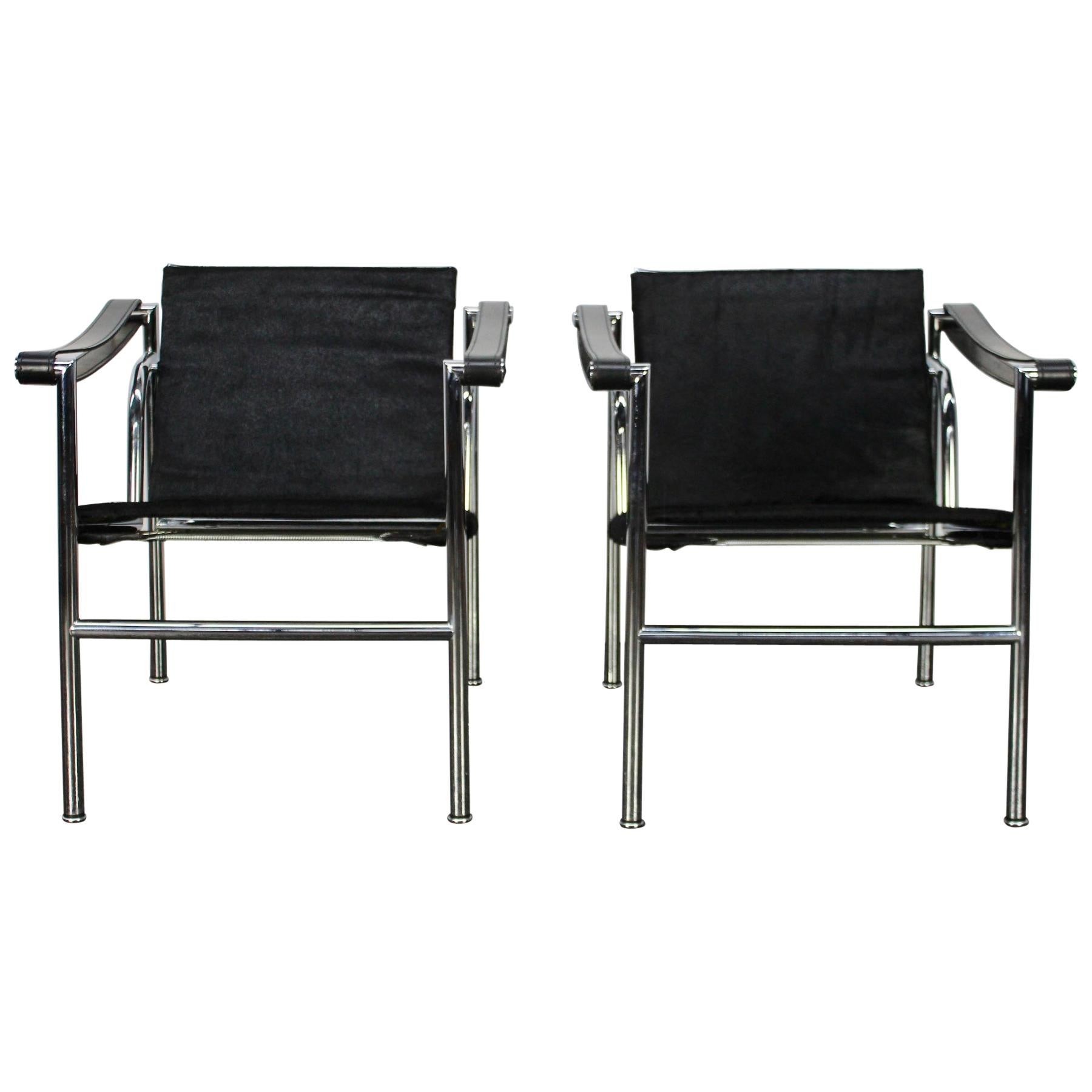 Pair of Cassina "LC1" Armchairs in Black "Ponyskin" Leather and Chrome