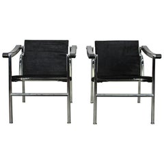 Pair of Cassina "LC1" Armchairs in Black "Ponyskin" Leather and Chrome