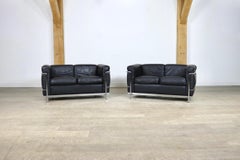 Pair of Cassina Lc2 Two Seater Sofas by Charlotte Perriand and Le Corbusier
