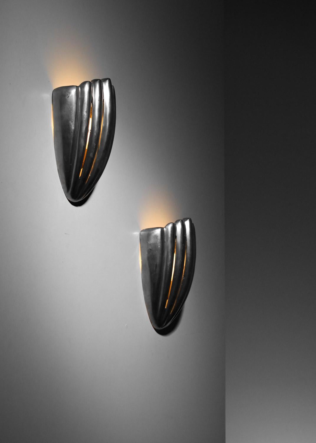 Mid-Century Modern Pair of cast aluminum shell wall lights For Sale