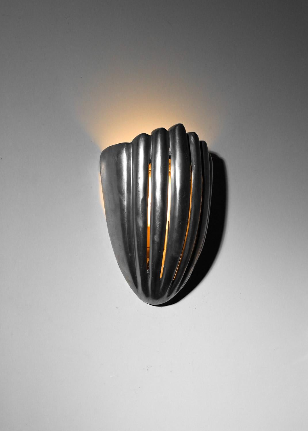 French Pair of cast aluminum shell wall lights For Sale