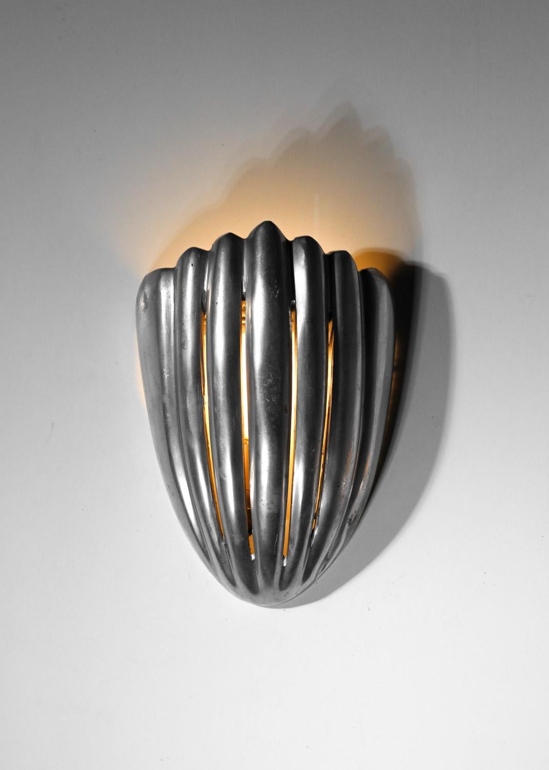 Mid-20th Century Pair of cast aluminum shell wall lights For Sale