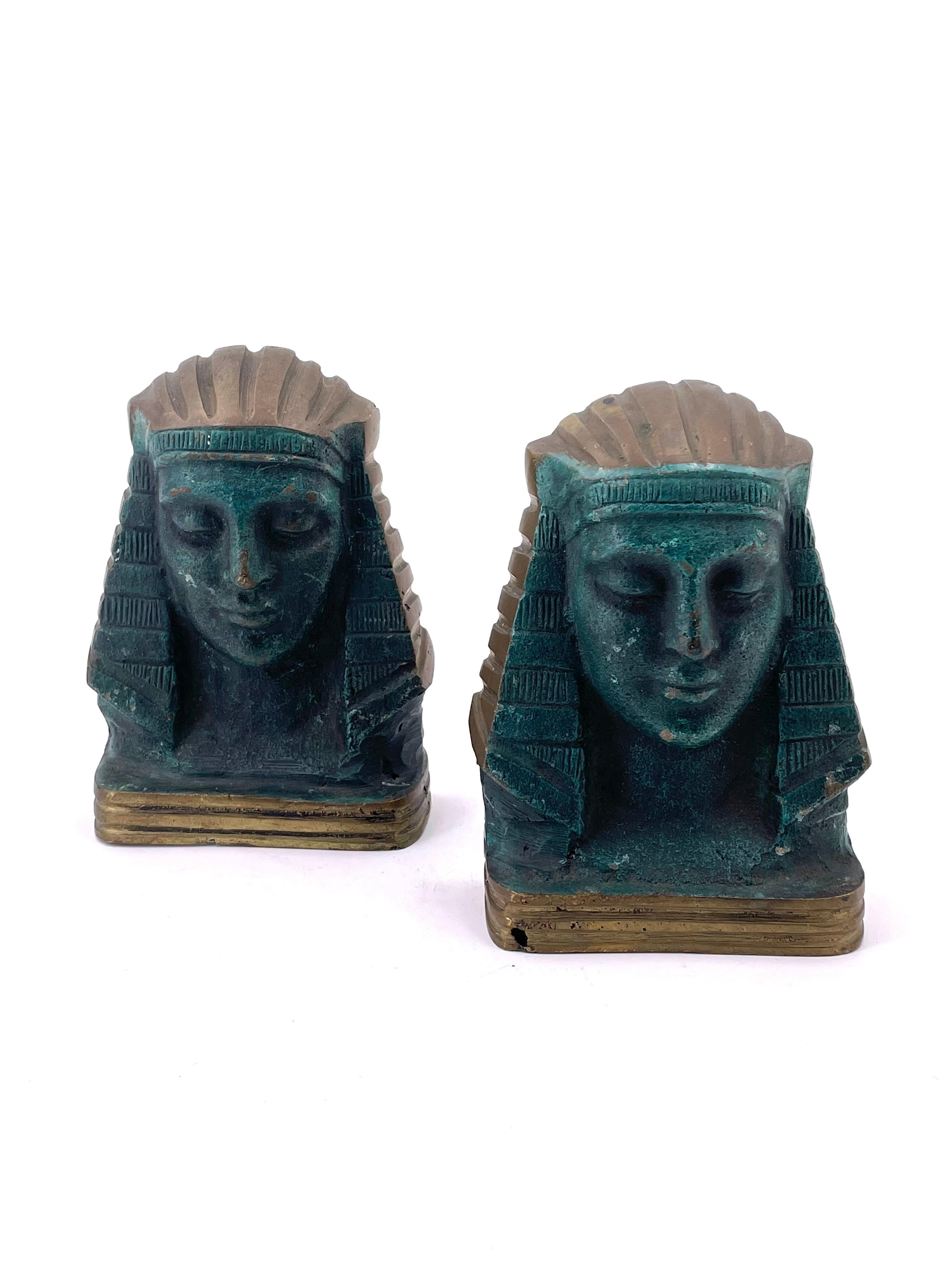 Nice and rare pair of patinated cast bronze Egyptian bookends, circa 1950s in original condition.