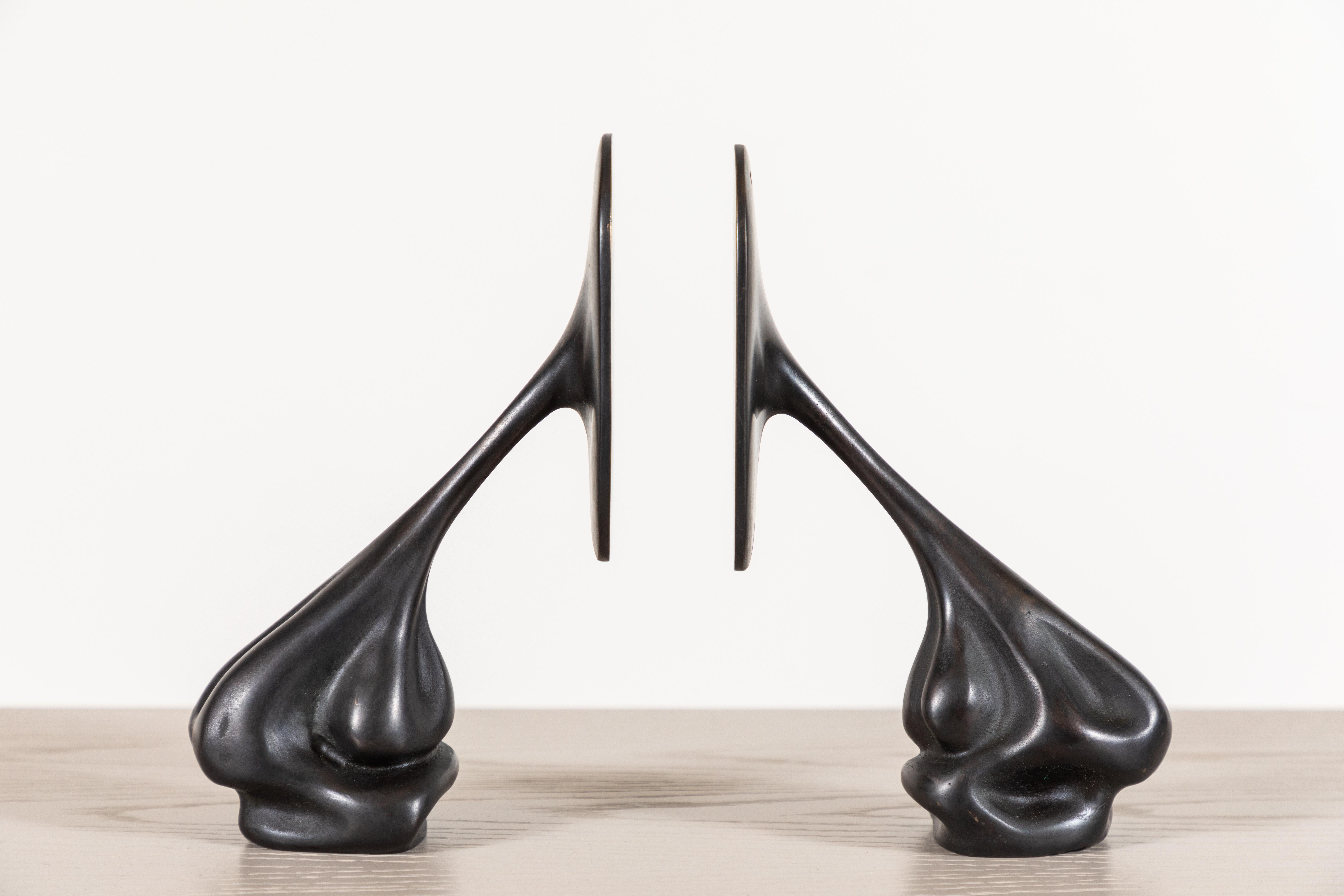 Pair of cast bronze bookends by artist Vincent Pocsik in collaboration with Lawson-Fenning. Made of natural materials, this decorative object can be accessorized on tabletop, book shelf, or desk to achieve an organic modern style. 

Vincent Pocsik