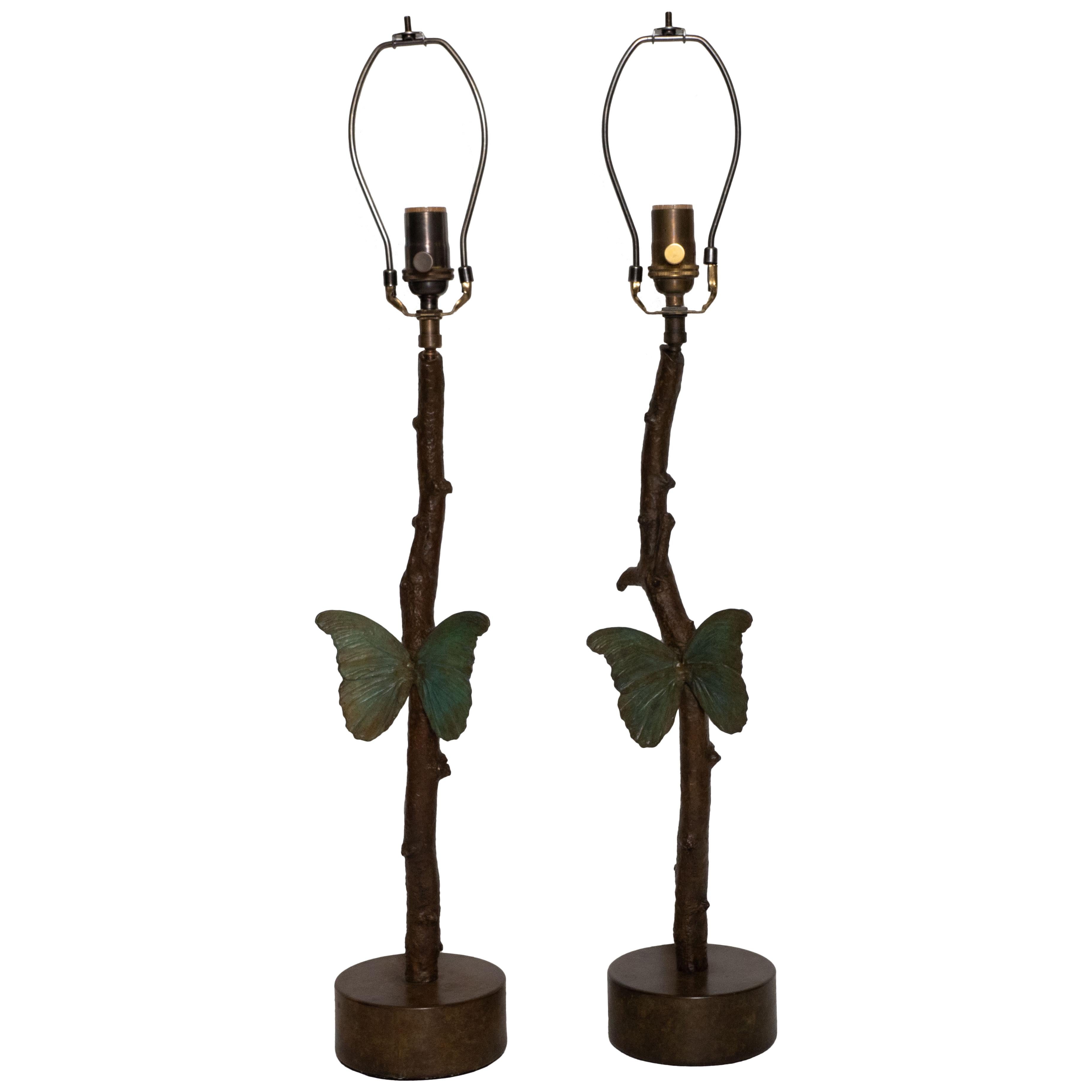 Pair of exquisitely cast bronze lamps depicting a butterfly on a branch.