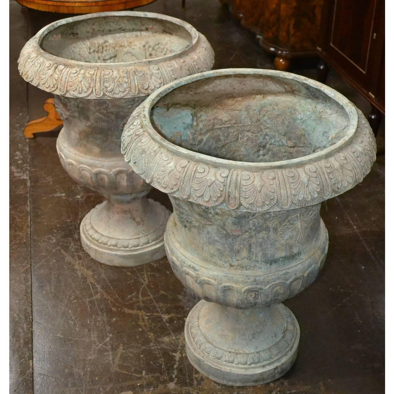 Pair of large softly patinated cast bronze planters made in the French style.
Measure: 31 inches height x 24 inches wide
Made in Thailand, circa 1985.