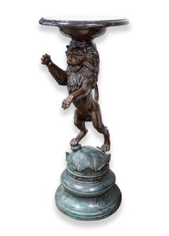 Pair of Cast Bronze Lion Sculptures with Marble Tops After P.J. Mene