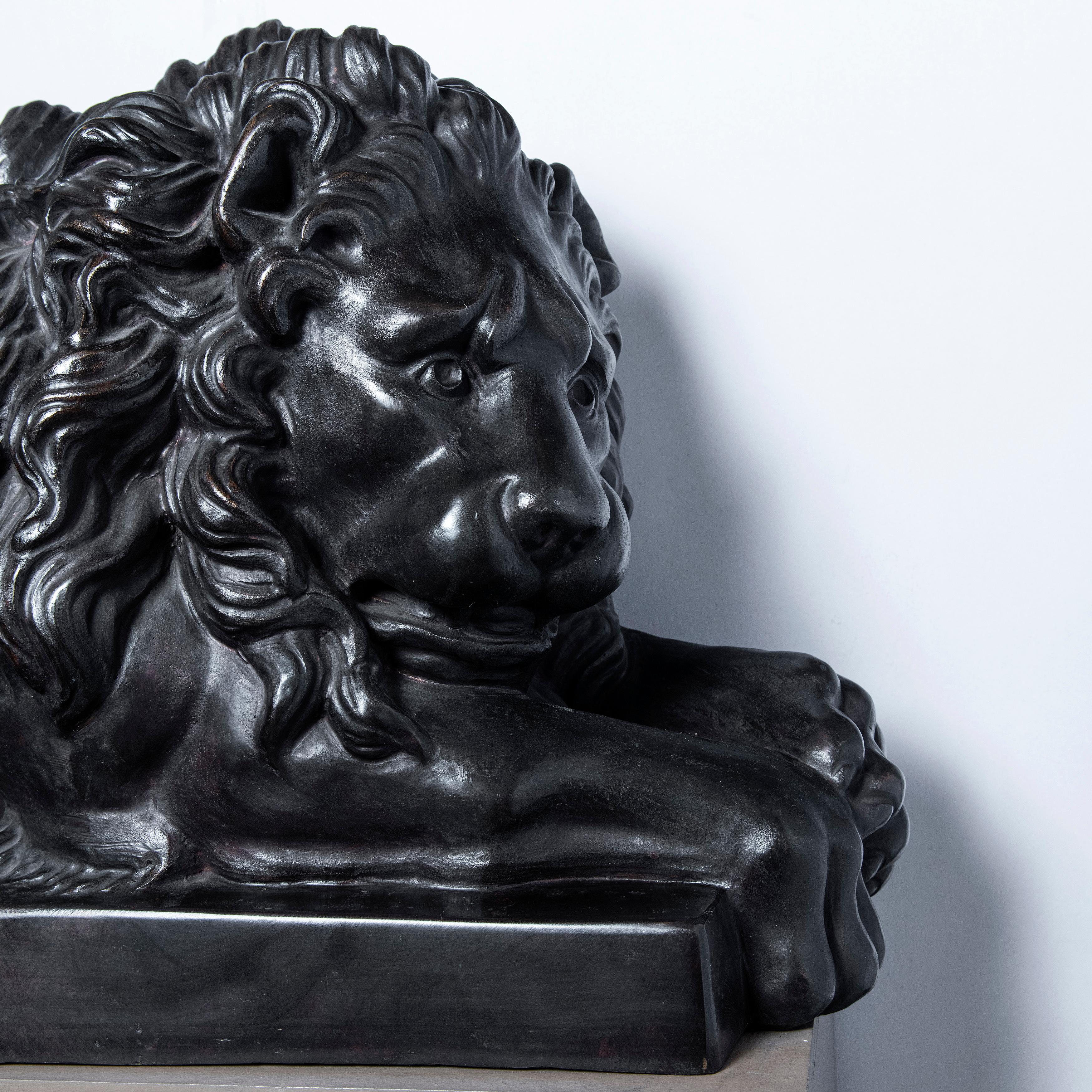 Pair of cast bronze lions, France, late 19th century.