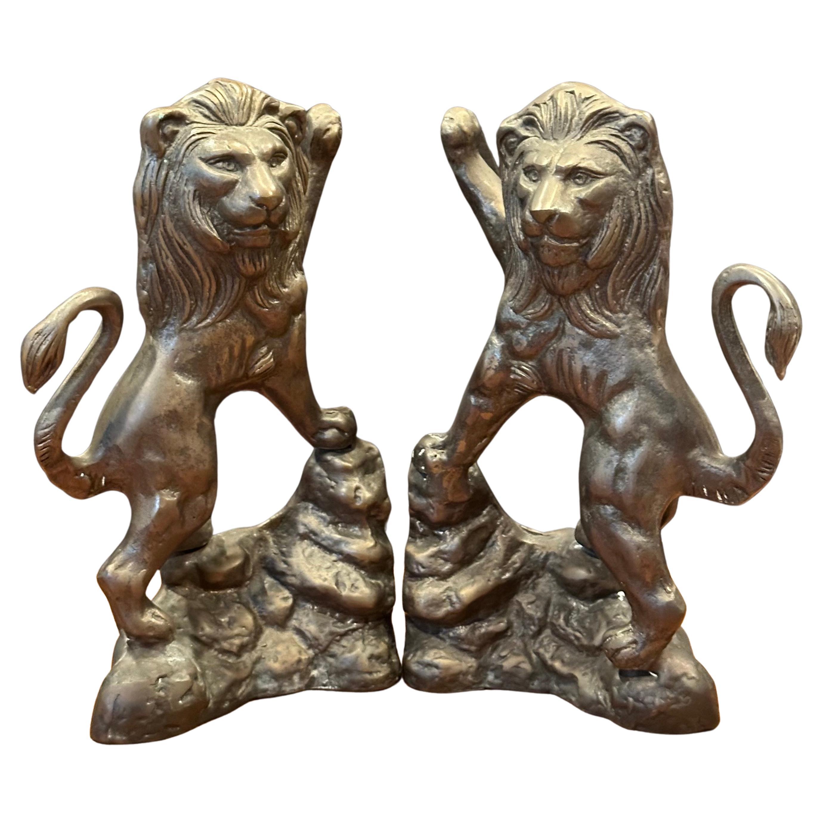 Pair of cast bronze standing lion bookends, circa 1980s.  The lions are beautifully crafted and are in very good vintage condition.  The set measures: 11.5”W x 3”D x 8.75”H.  #3820