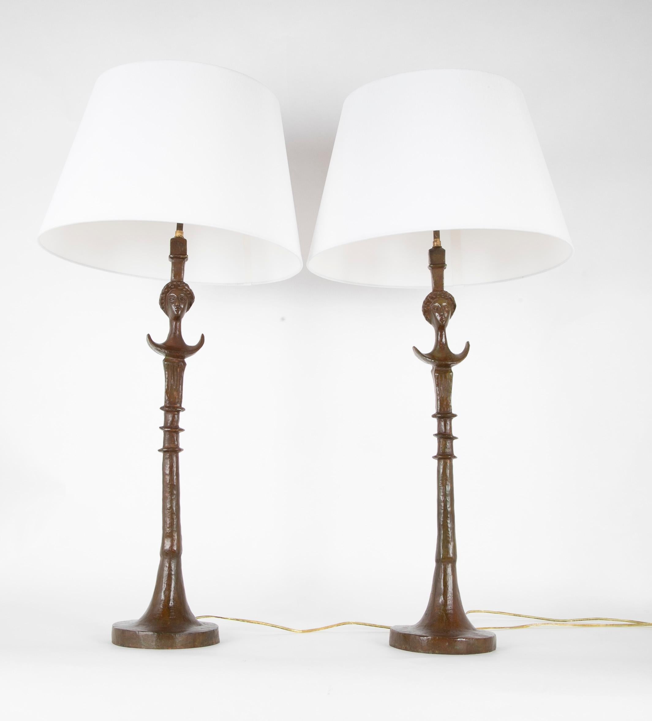 Pair of cast bronze table lamps in the style of Giacometti 