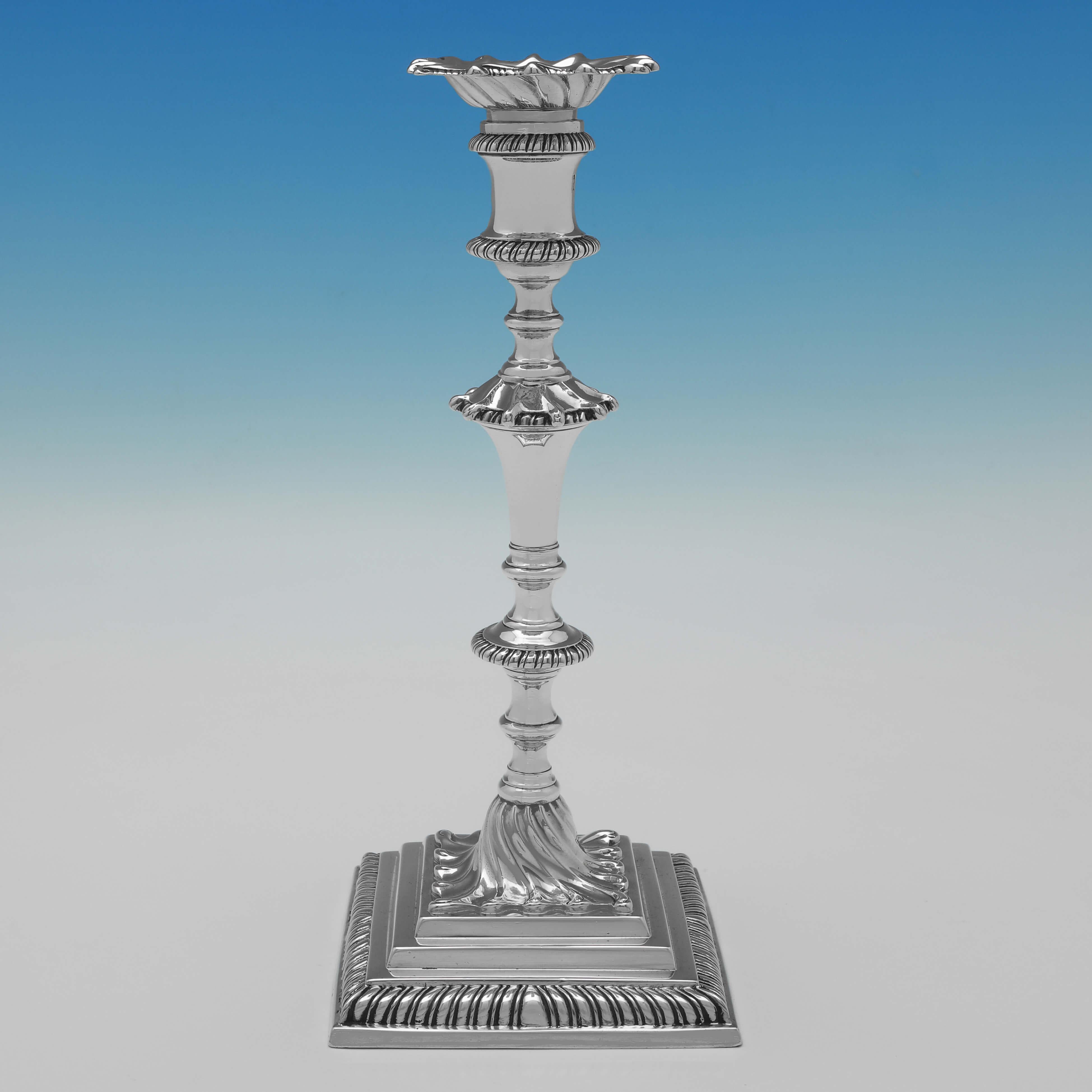 Hallmarked in London in 1763 by Elizabeth Cooke, this attractive pair of cast, George III period, Antique Sterling Silver Candlesticks stand on stepped bases, featuring gadroon borders, and engraved underneath with 'Robert Galland - Sans Tache