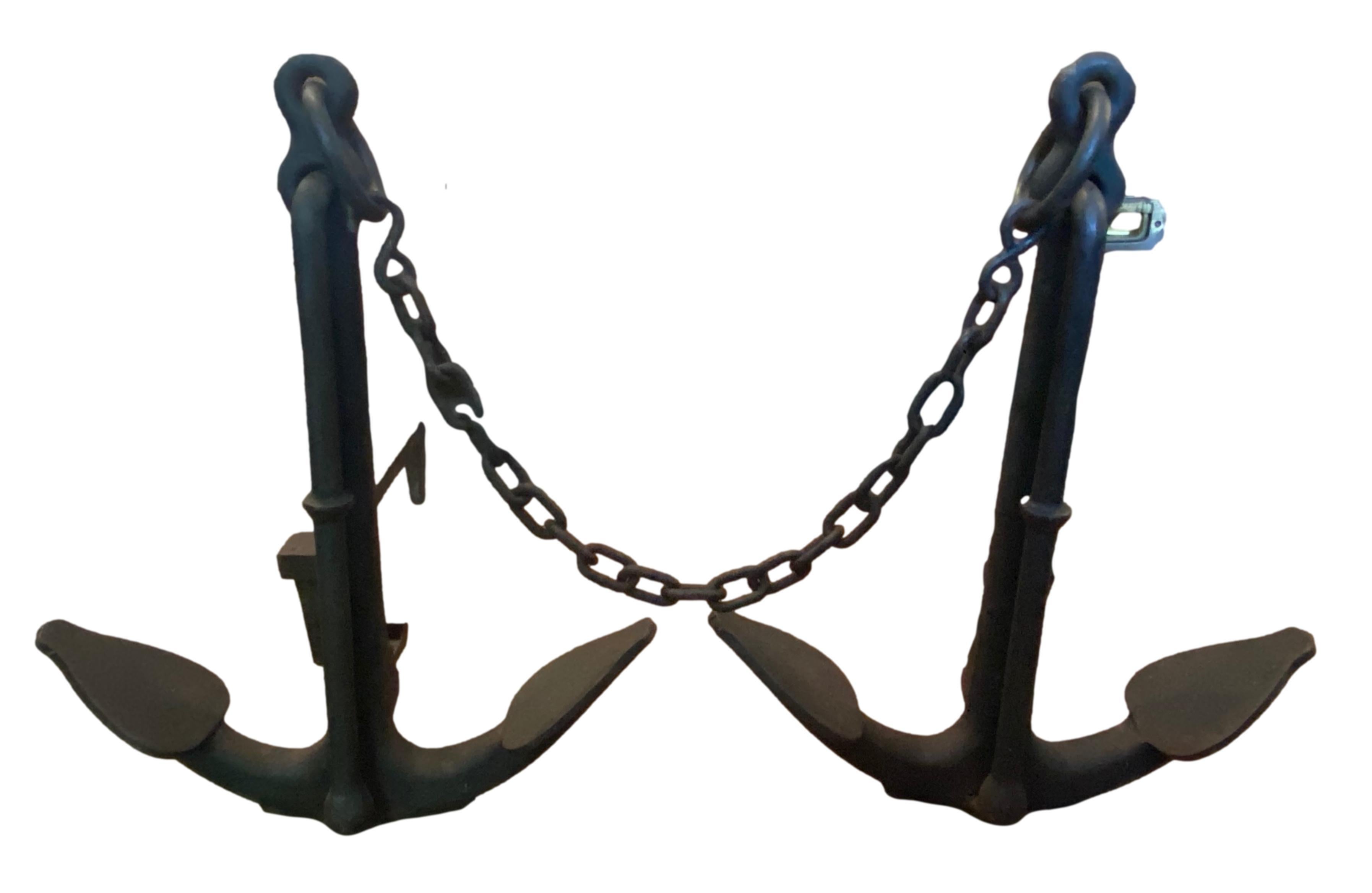 Handsome pair of cast iron anchors as andirons with attached chain..... in very good condition.....