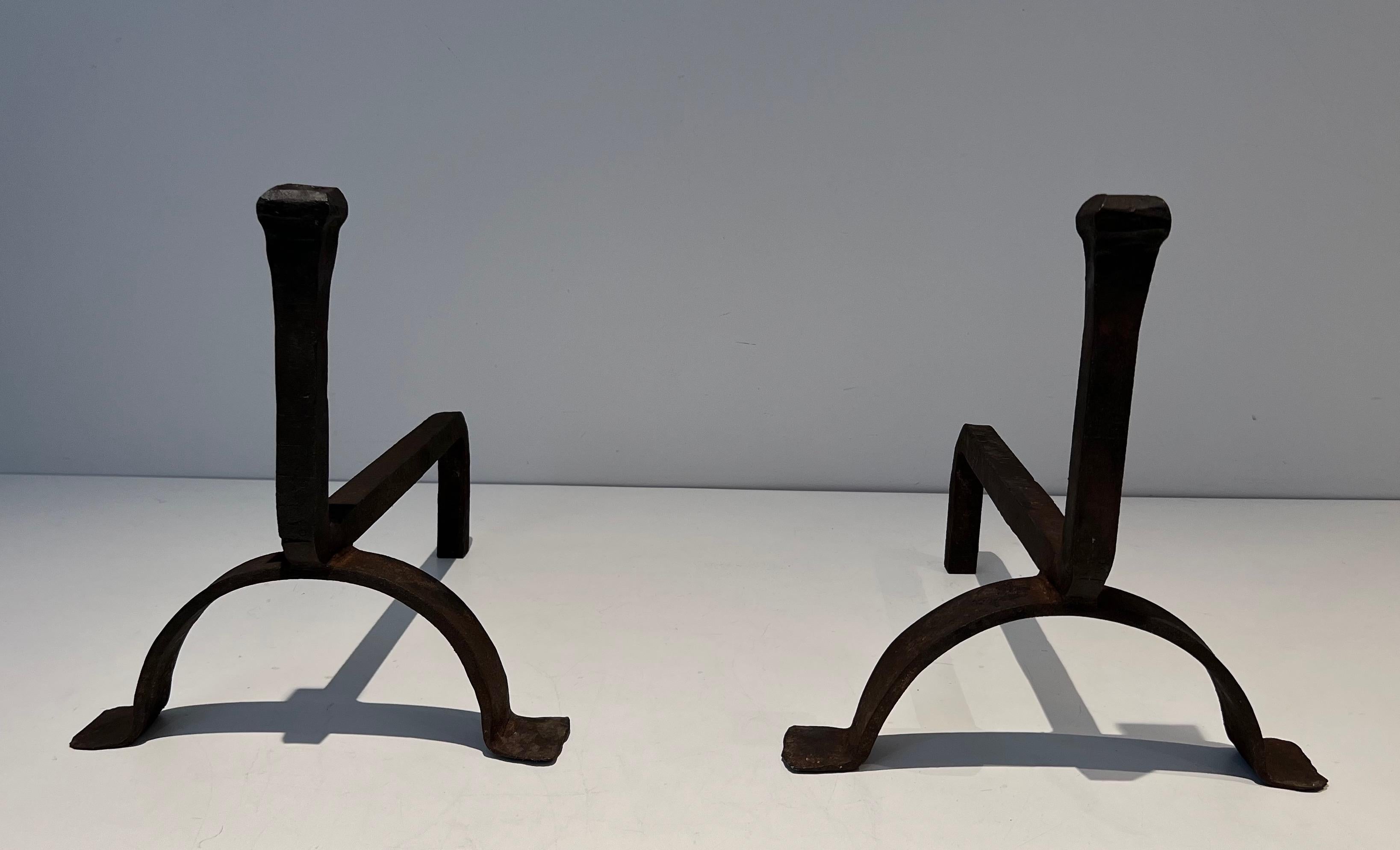 This pair of gothic andirons is made of cast iron and wrought iron. This is a French work. Circa 1970.