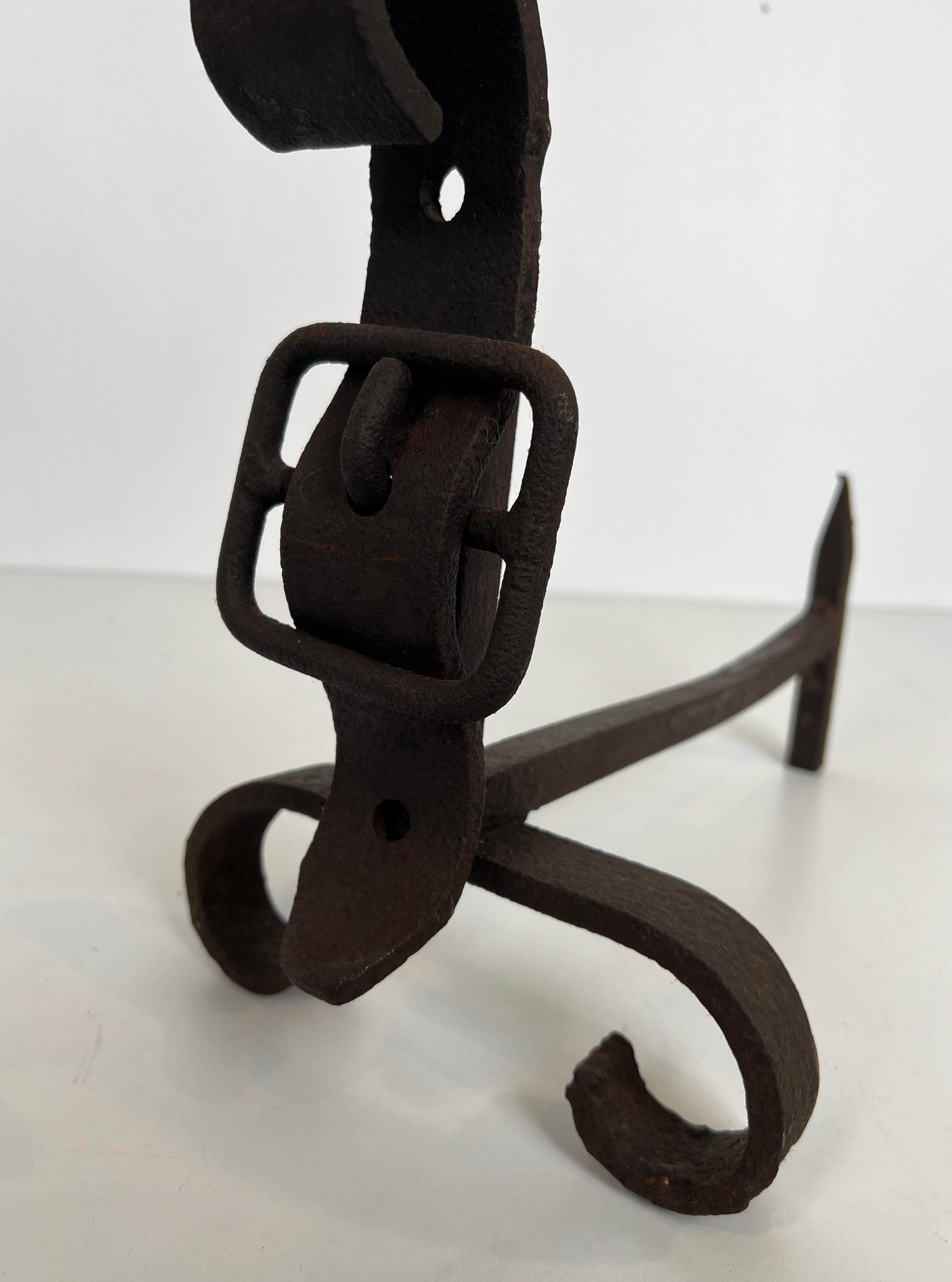 Pair of cast iron and wrought iron andirons representing a belt. French work. For Sale 4