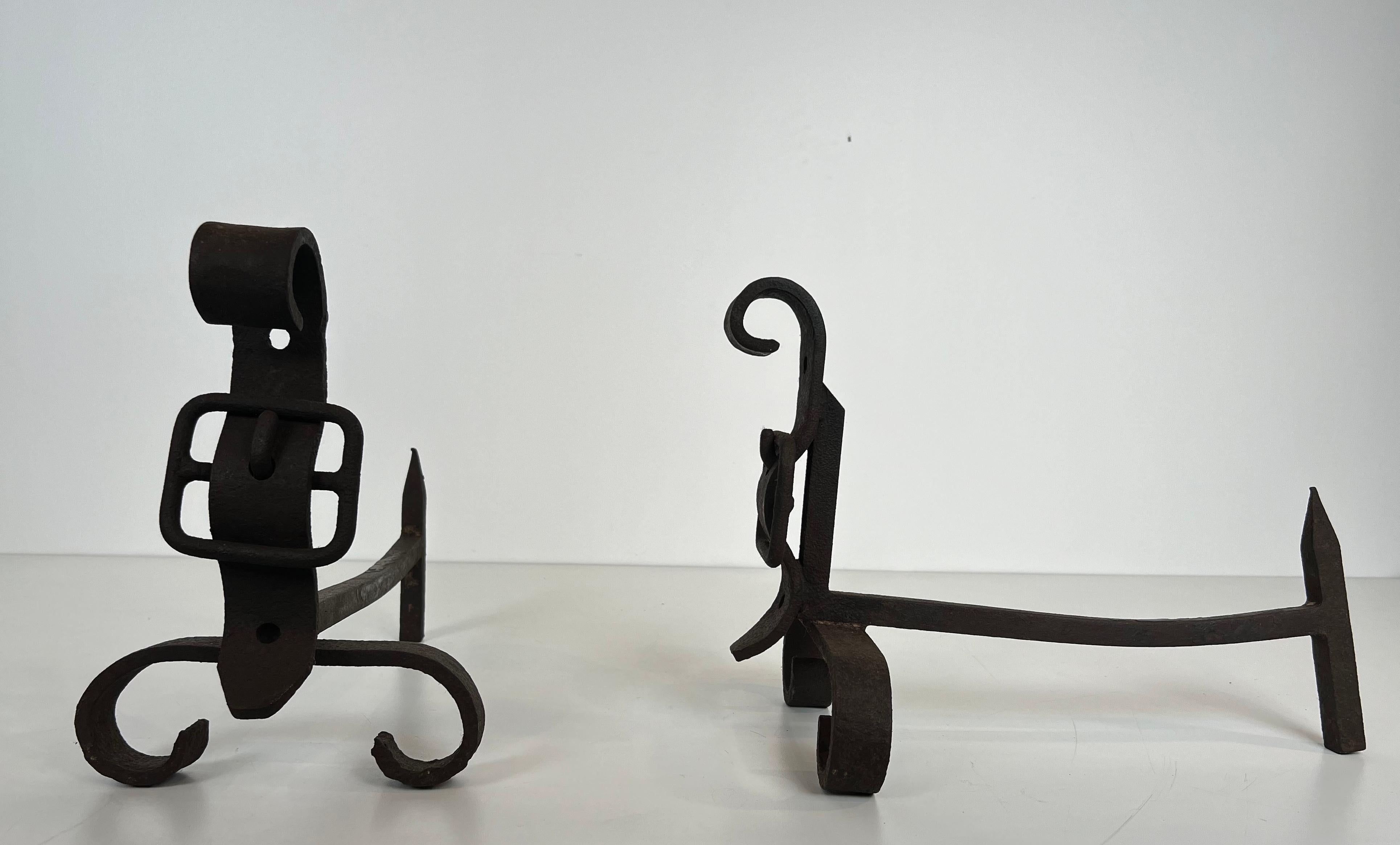 Mid-20th Century Pair of cast iron and wrought iron andirons representing a belt. French work. For Sale