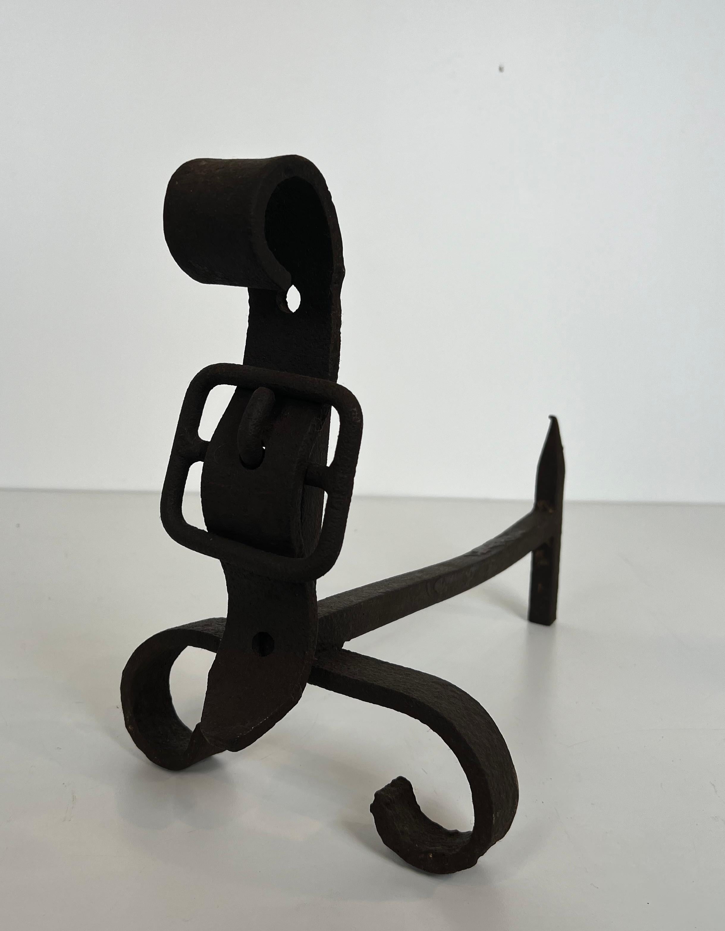Pair of cast iron and wrought iron andirons representing a belt. French work. For Sale 1
