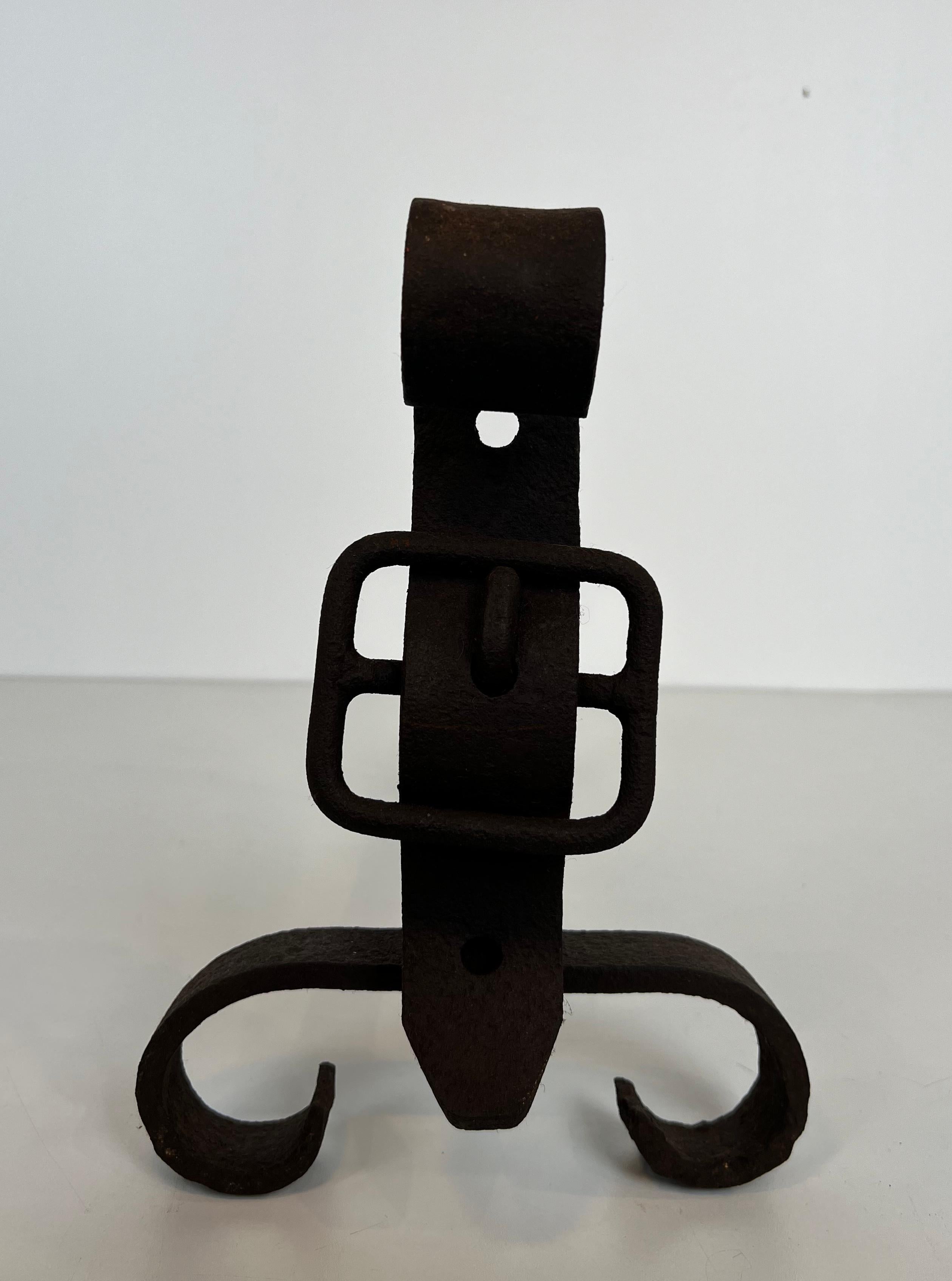Pair of cast iron and wrought iron andirons representing a belt. French work. For Sale 2