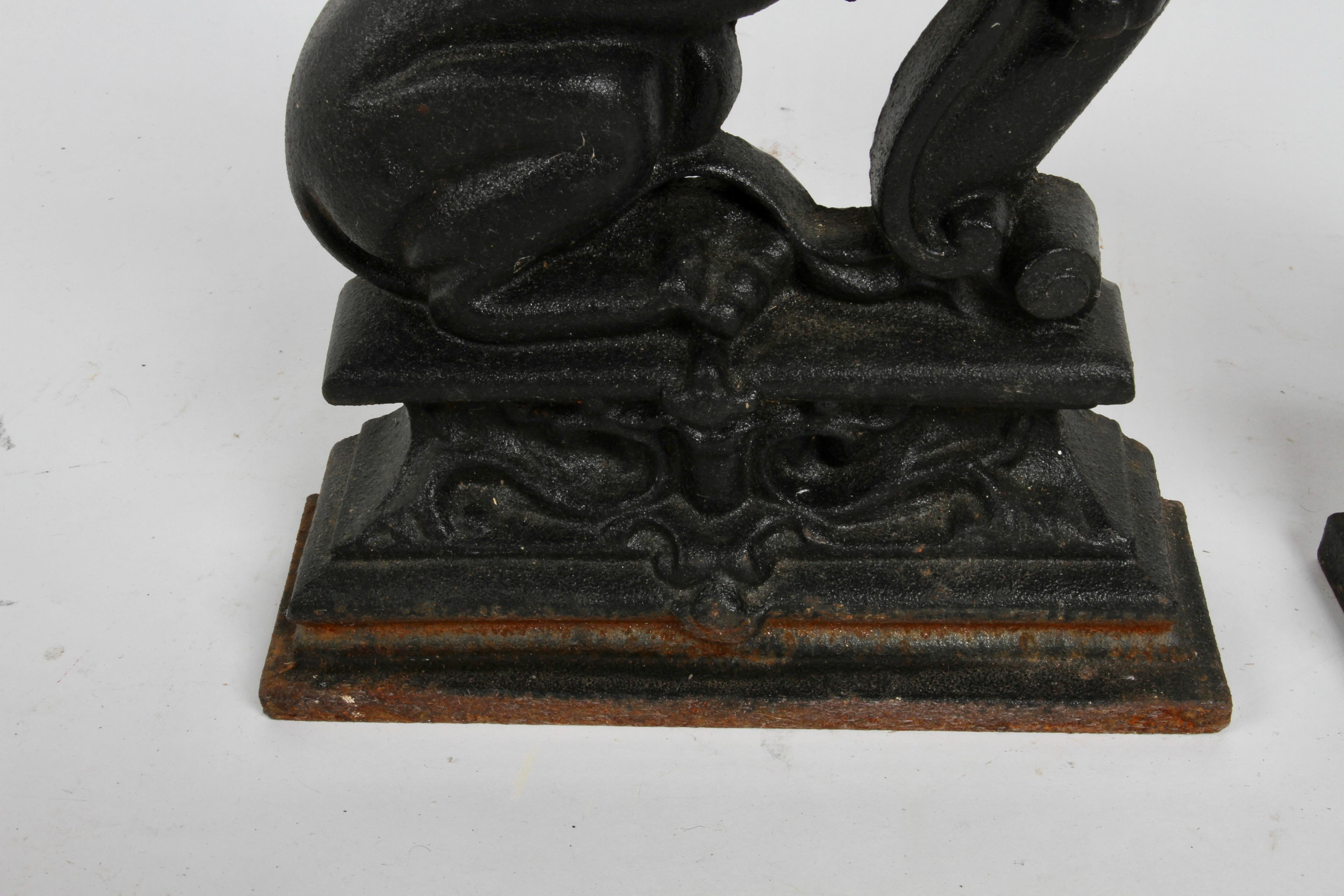 Beaux Arts Pair of Cast Iron Andirons or Fire Dogs of Rampant Lions Resting on Shield