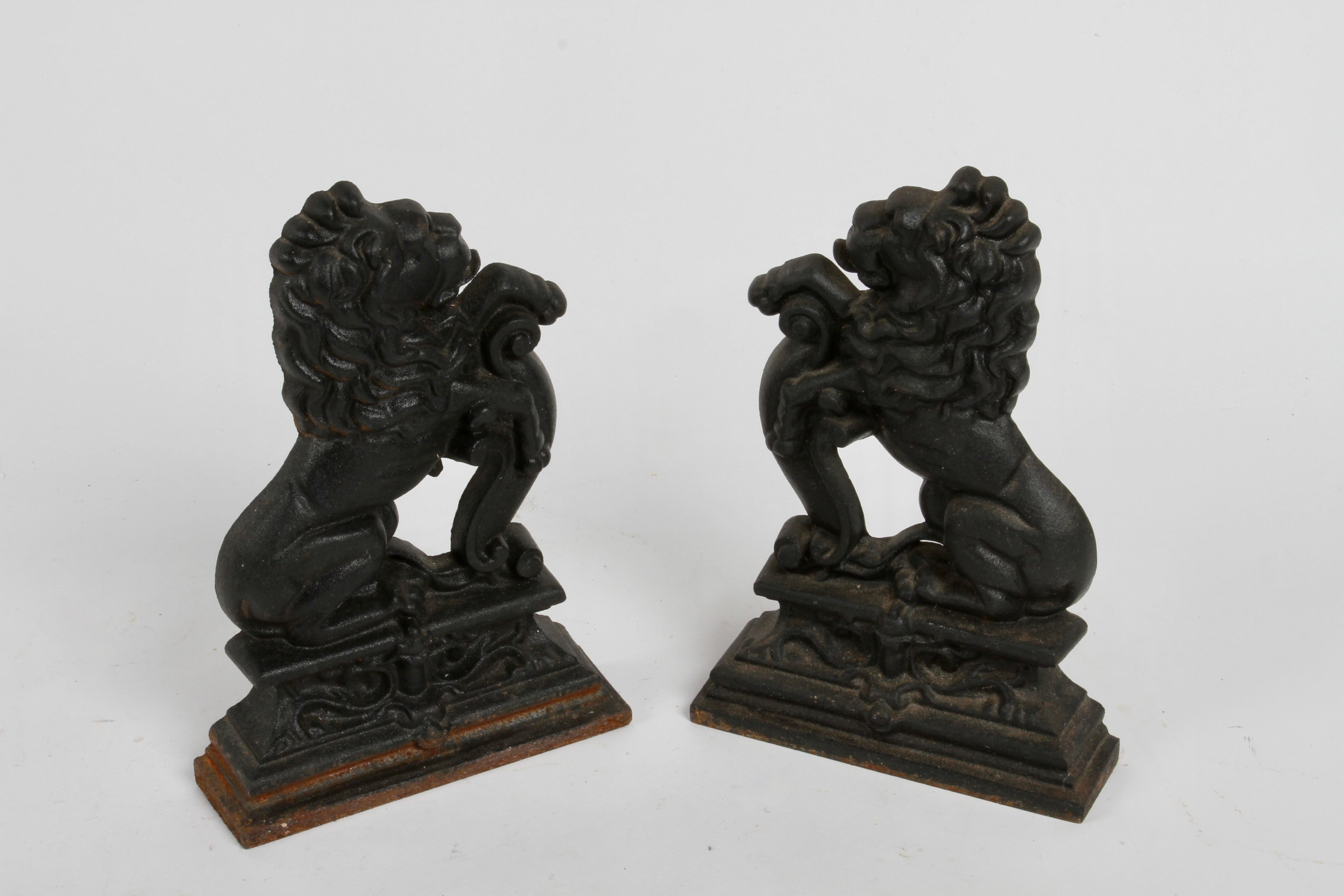 English Pair of Cast Iron Andirons or Fire Dogs of Rampant Lions Resting on Shield