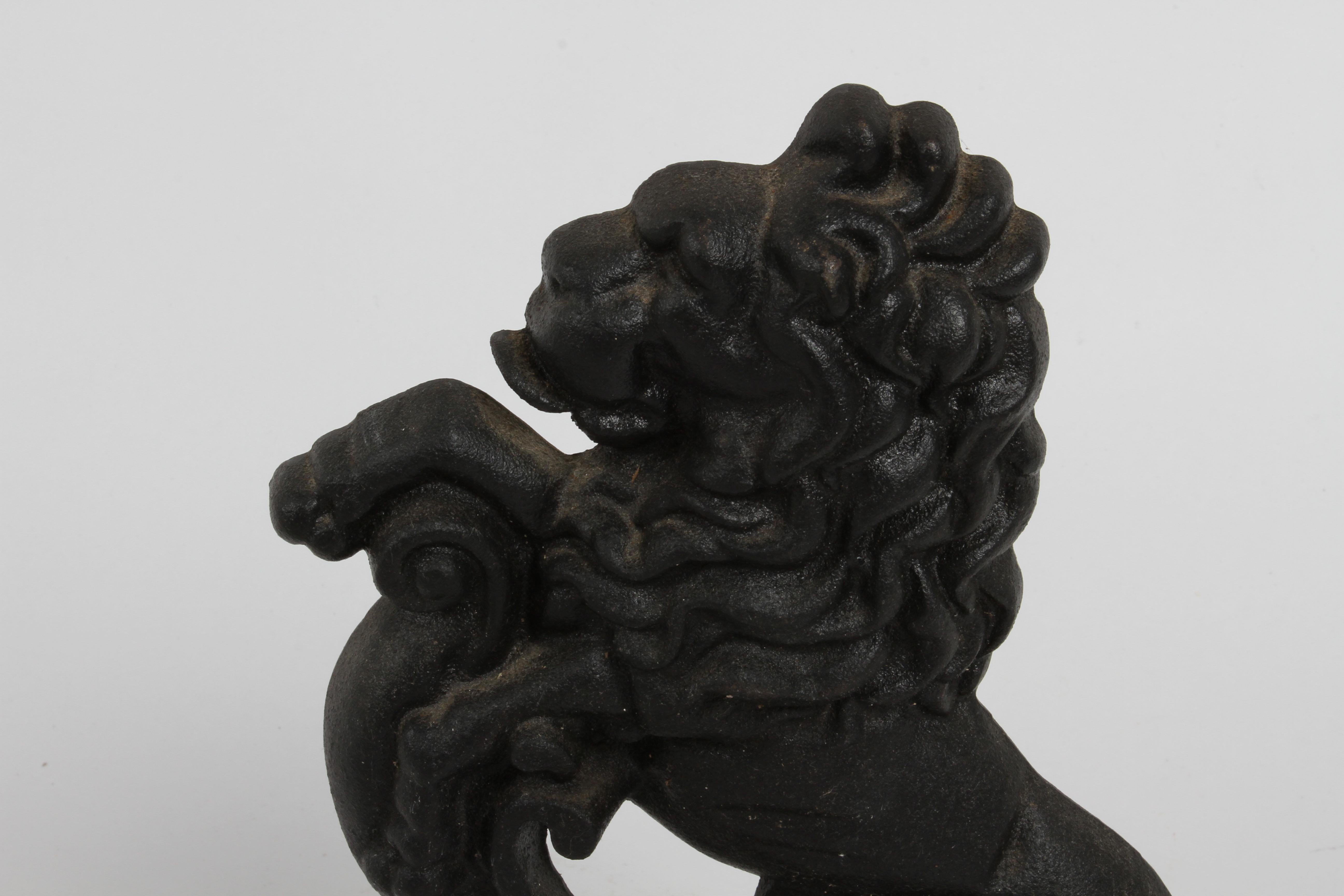 Pair of Cast Iron Andirons or Fire Dogs of Rampant Lions Resting on Shield In Good Condition In St. Louis, MO