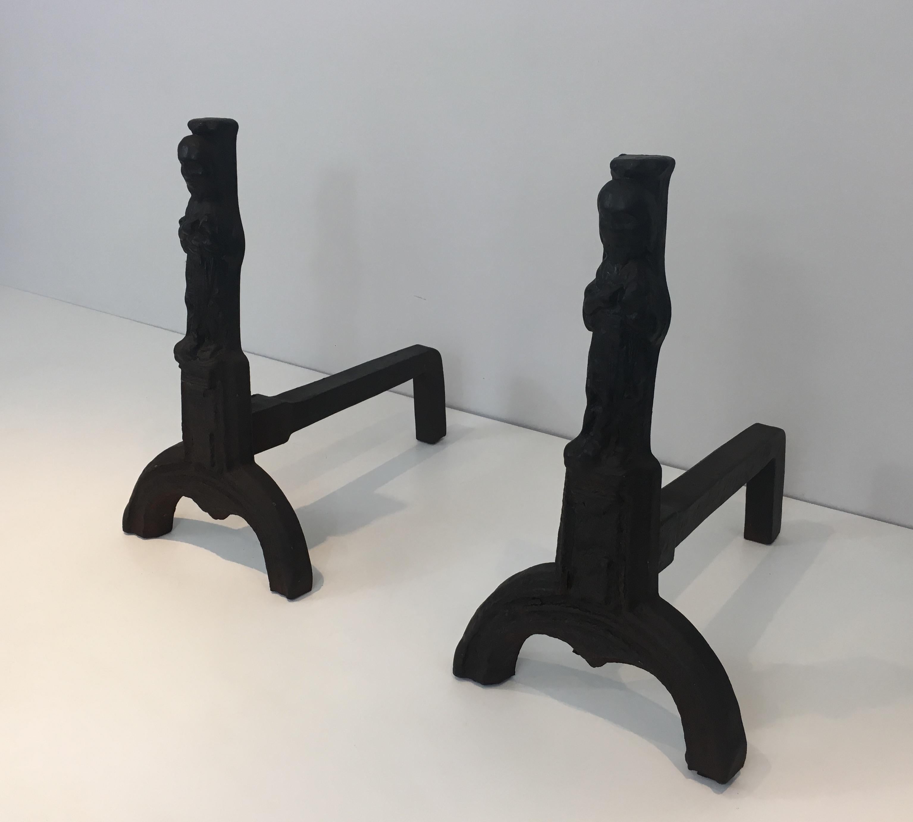 This pair of cast iron andirons represents an Evangelist. They are French, circa 1940.