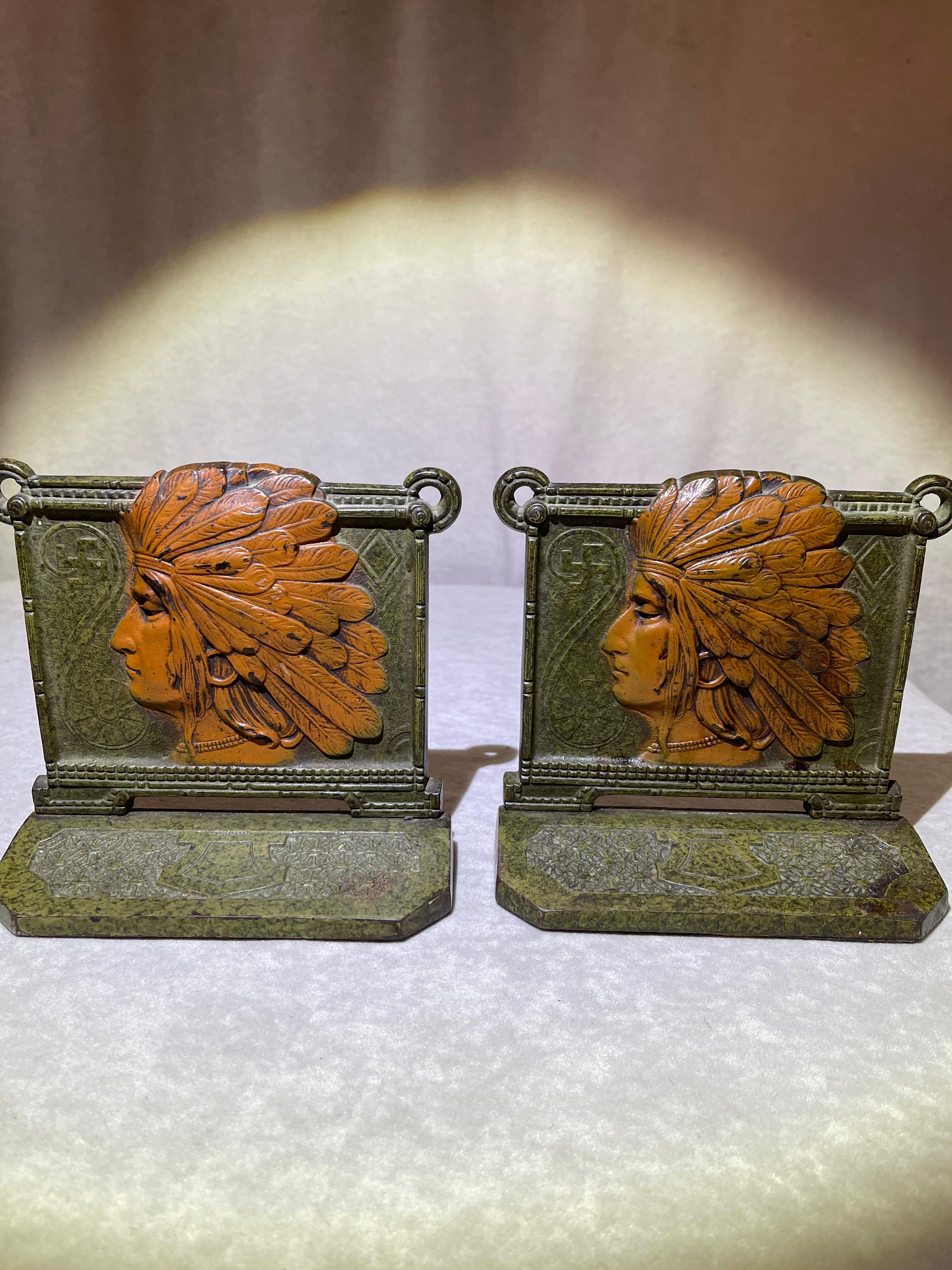 These exceptionally high quality cast iron bookends were made by the Judd Company, which has a rich history dating back to 1833. The detail, the authentic paint, and even the back of these are all really the very best quality. These are very heavy,