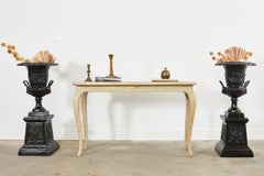 Pair of Cast Iron Campana Form Garden Urns on Stands