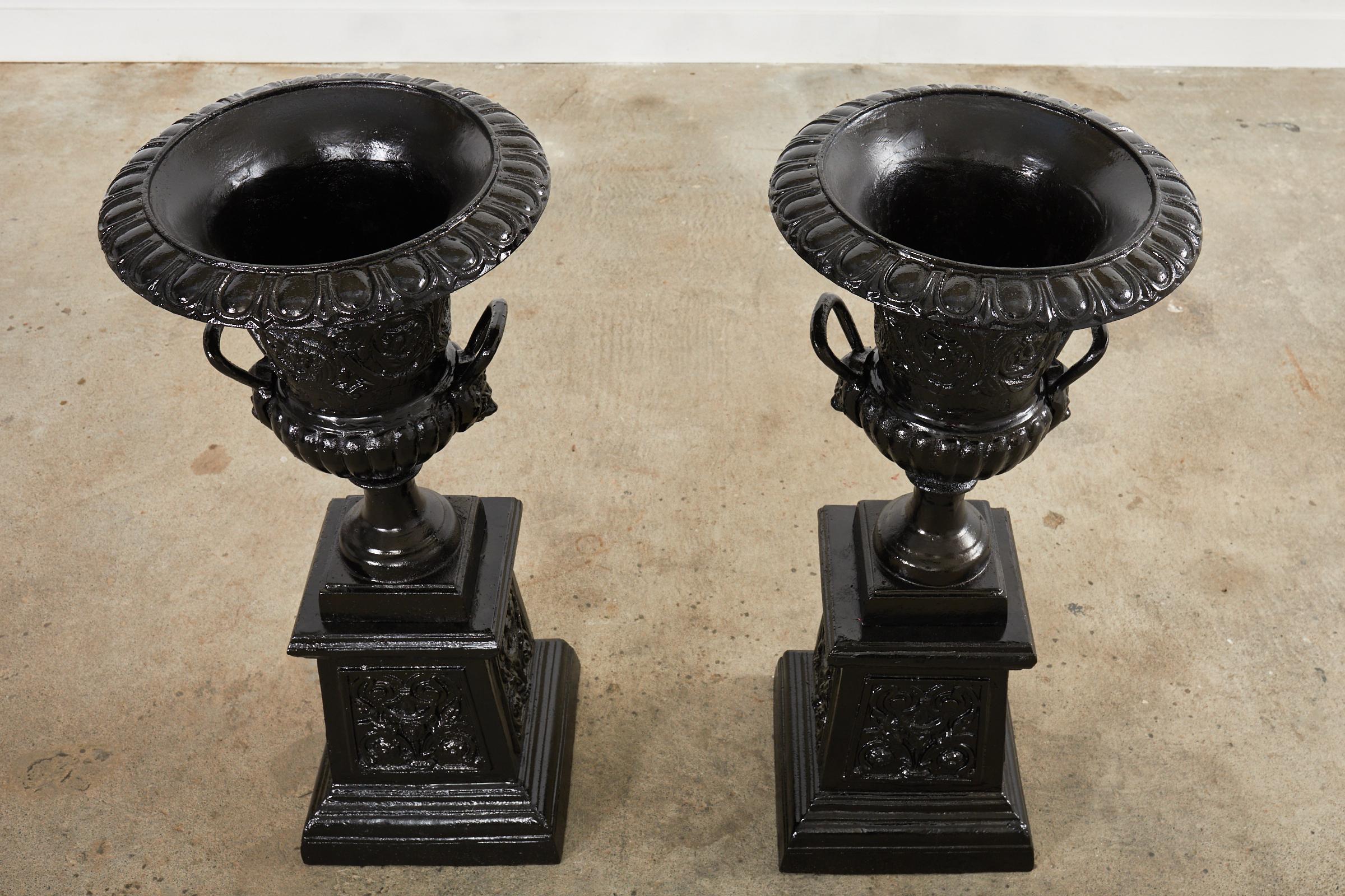 Painted Pair of Cast Iron Campana Form Garden Urns on Stands For Sale