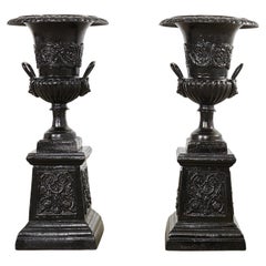 Pair of Cast Iron Campana Form Garden Urns on Stands