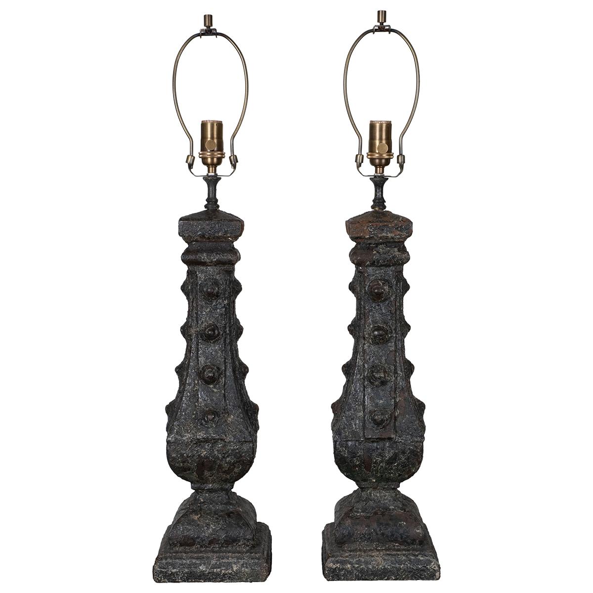 Pair of cast iron columnar table lamps with patinated finish
