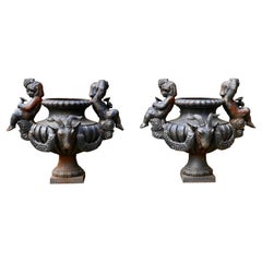 Pair of Cast Iron Garden Urns with Cherubs & Rams Heads