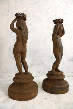 Pair of Cast Iron Girl on Plinths with a Stockholm Foundry Stamp